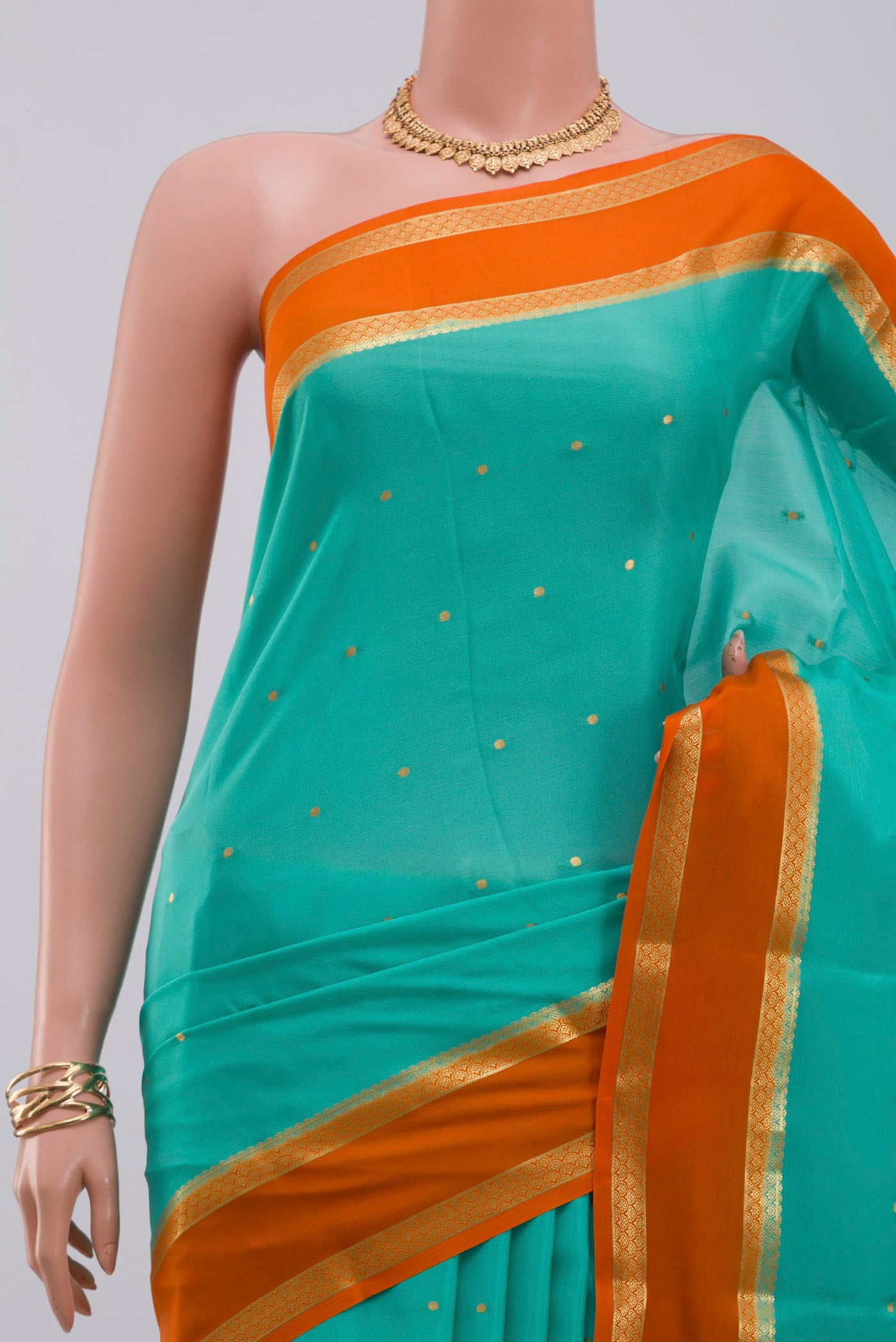 Border image of Sky Blue Crepe Saree with Zari Butta on the body and Zari Border. 