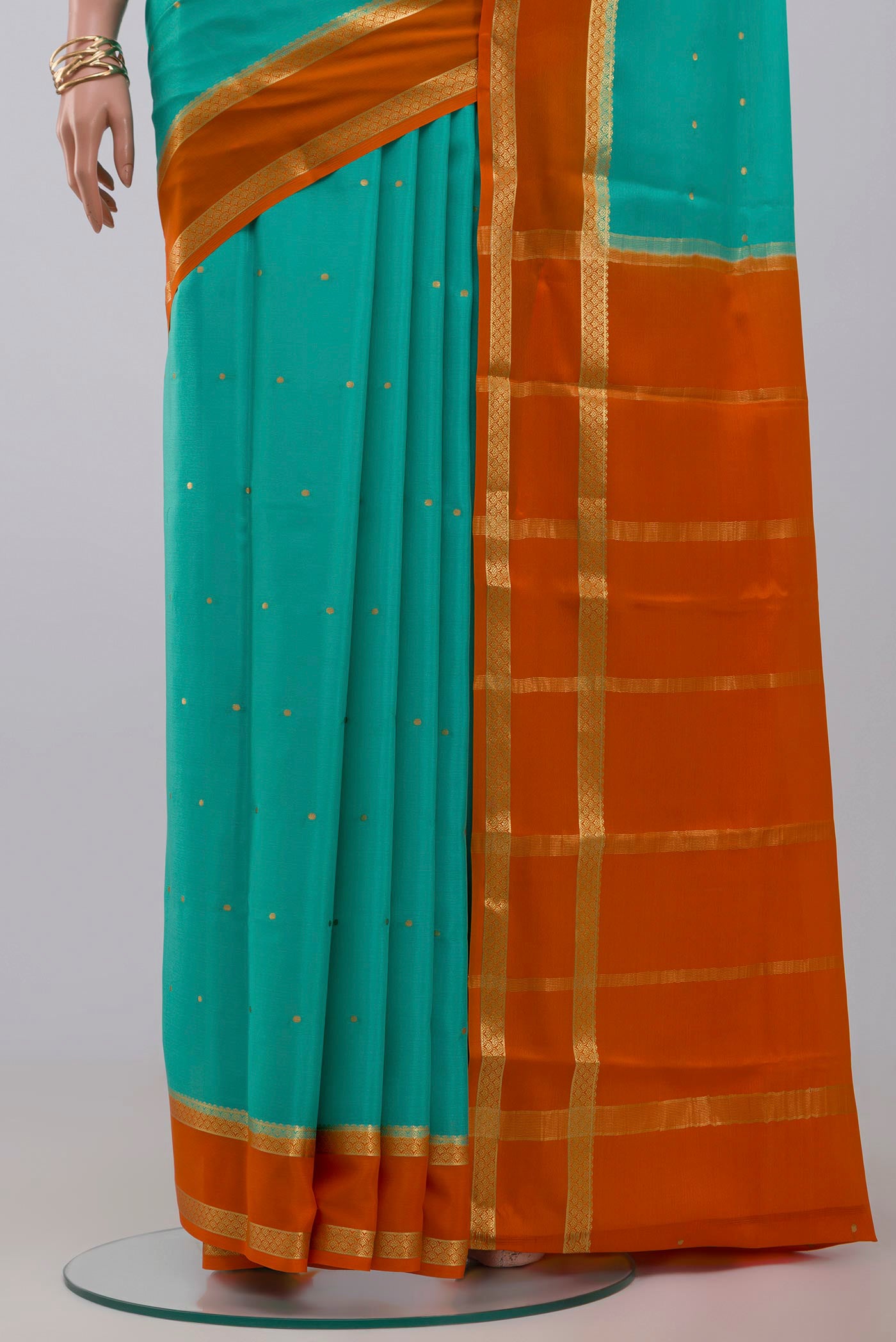 Pleats and pallu of Sky Blue Crepe Saree with Zari Butta on the body and Zari Border. 