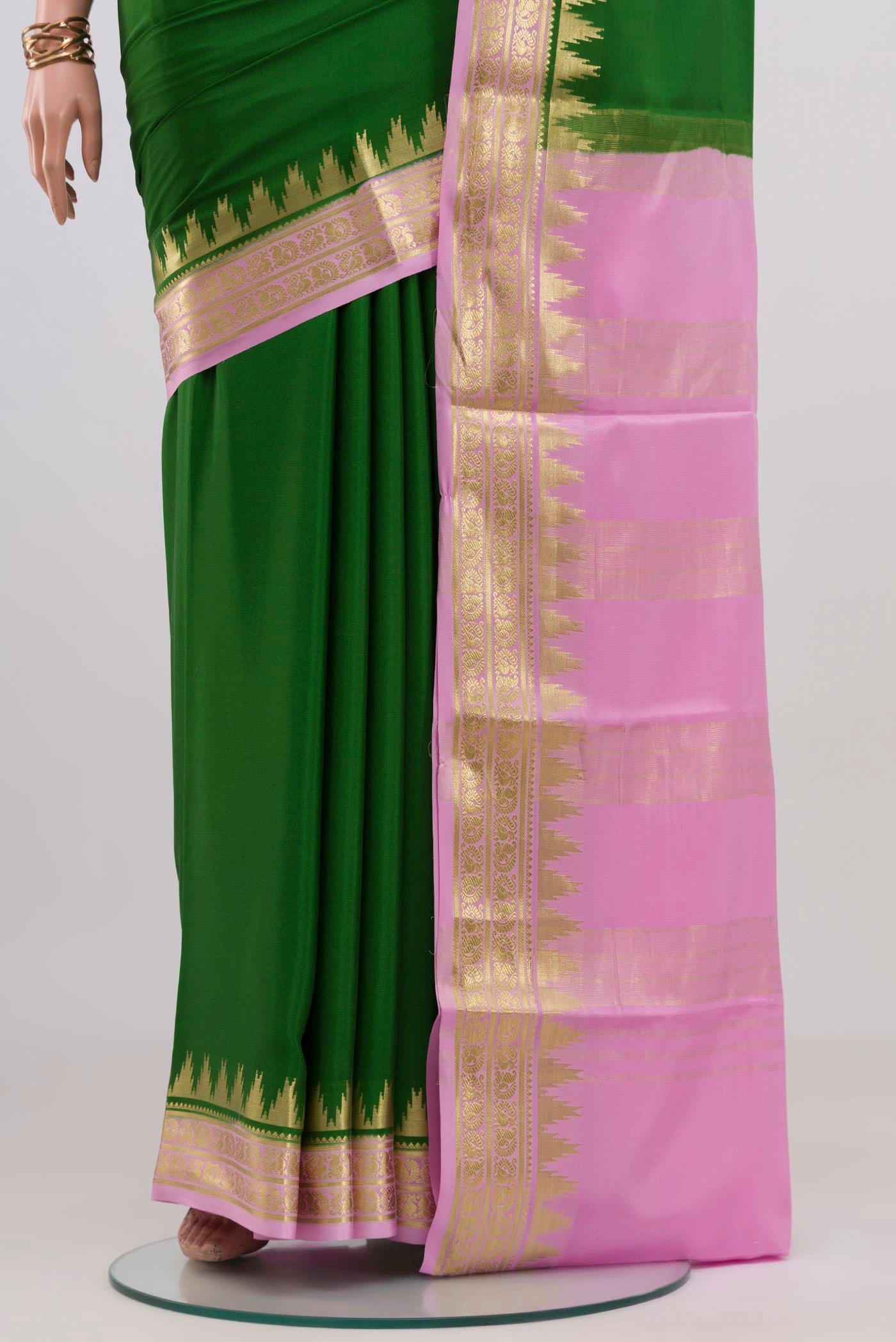 Pleats and pallu of Green Mysore Crepe Saree with Plain Body and Zari Border. 