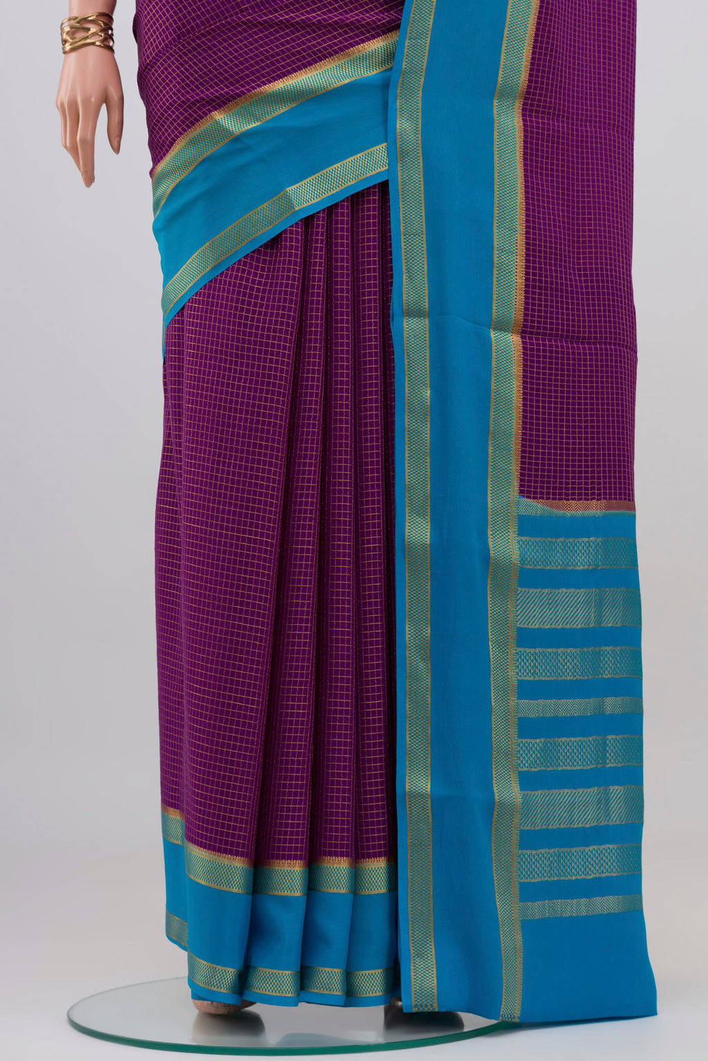 Pleats and pallu of Purple Mysore Crepe Saree with Checked design on the body and Zari Border. 