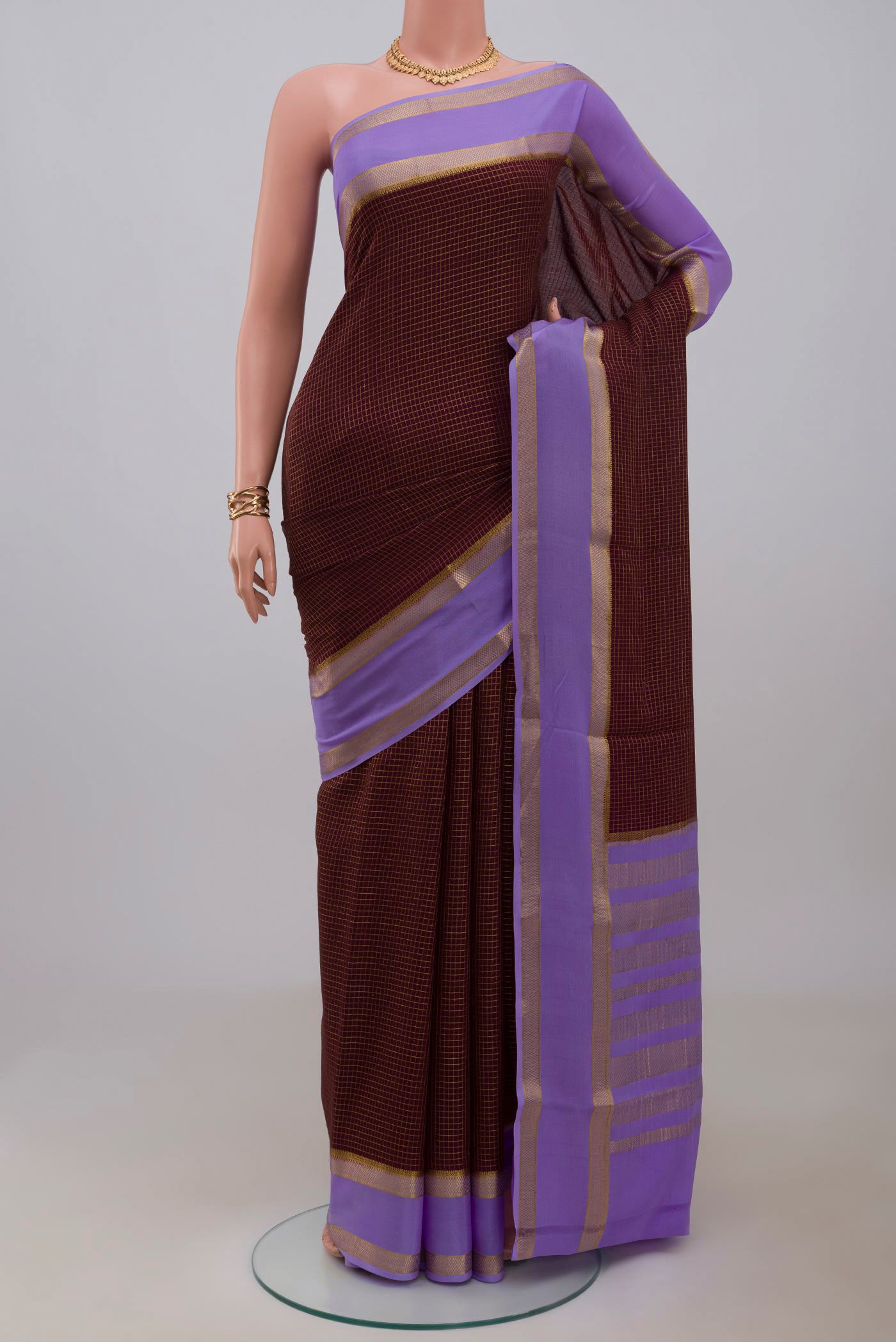 Coffee Brown Mysore Crepe Saree with Checked design on the body and Zari Border.  displayed on a mannequin