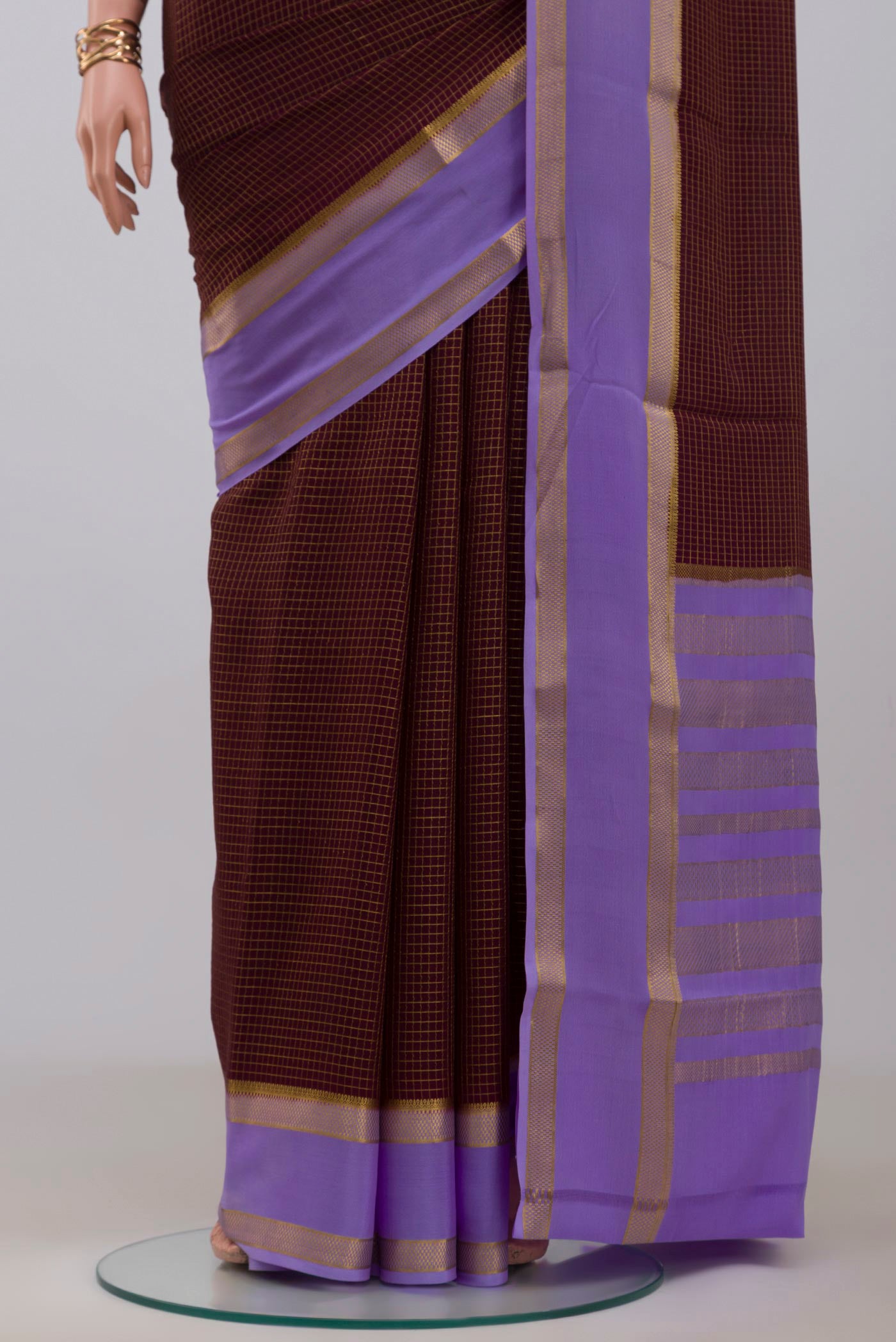 Pleats and pallu of Coffee Brown Mysore Crepe Saree with Checked design on the body and Zari Border. 