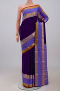 Navy Blue Mysore Crepe Saree with Zari Butta on the body and Zari Border.  displayed on a mannequin