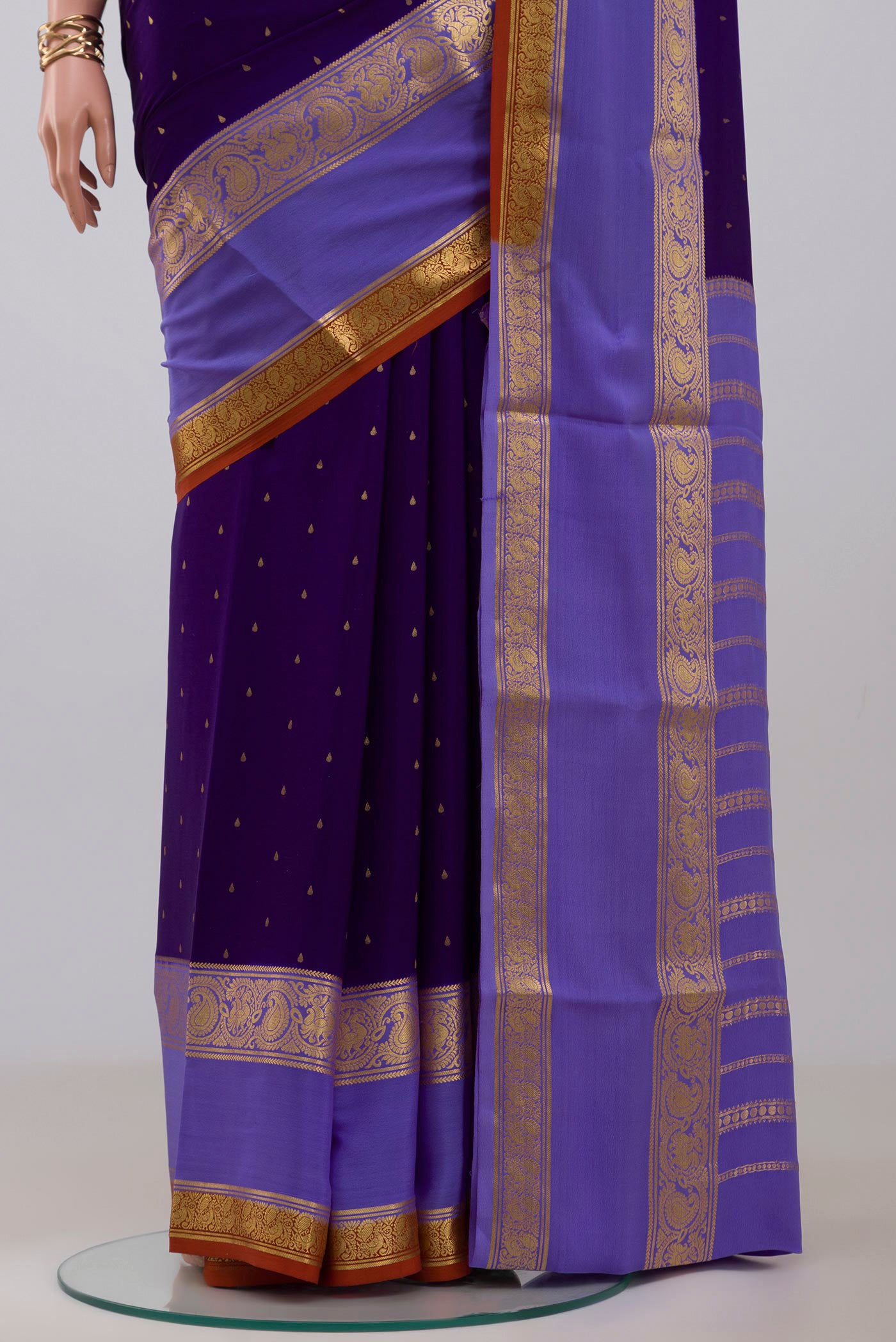 Pleats and pallu of Navy Blue Mysore Crepe Saree with Zari Butta on the body and Zari Border. 