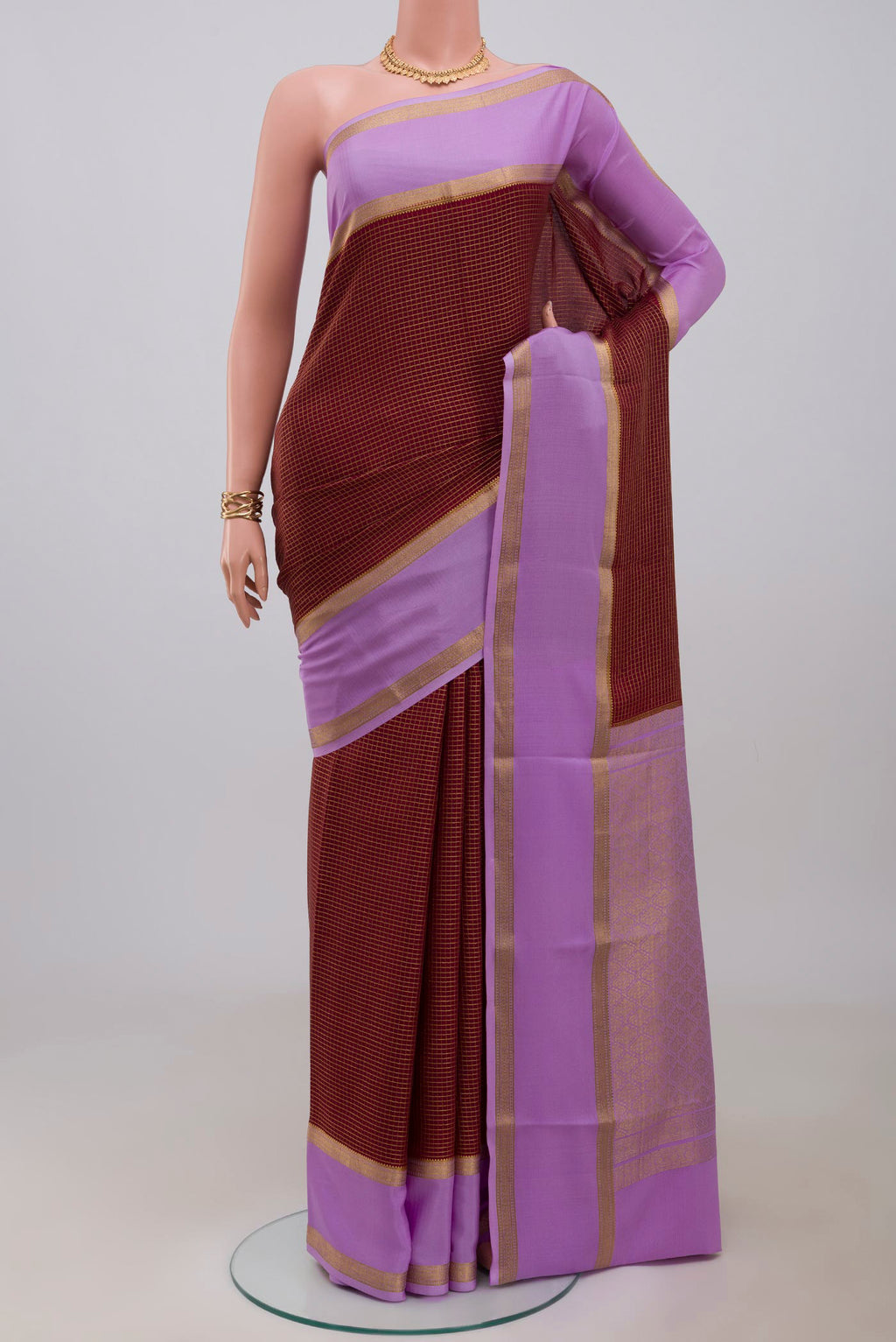 Maroon Mysore Crepe Saree with Checked design on the body and Zari Border.  displayed on a mannequin