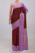 Maroon Mysore Crepe Saree with Checked design on the body and Zari Border.  displayed on a mannequin
