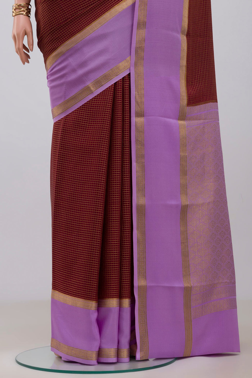 Pleats and pallu of Maroon Mysore Crepe Saree with Checked design on the body and Zari Border. 
