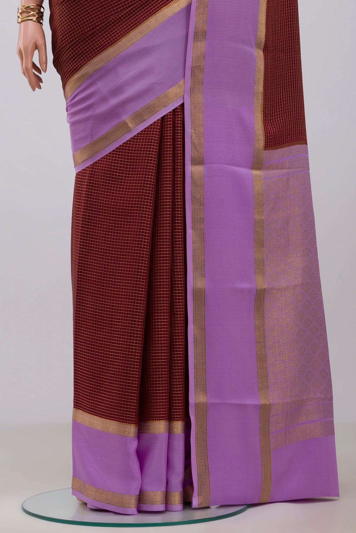 Pleats and pallu of Maroon Mysore Crepe Saree with Checked design on the body and Zari Border. 