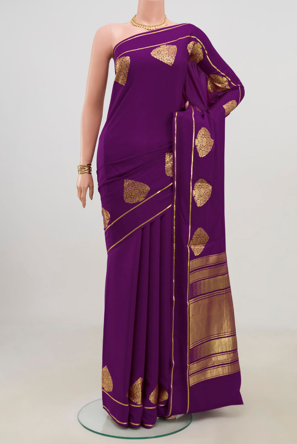 Purple Crepe Saree with Plain Body and Thin Zari Line.  displayed on a mannequin