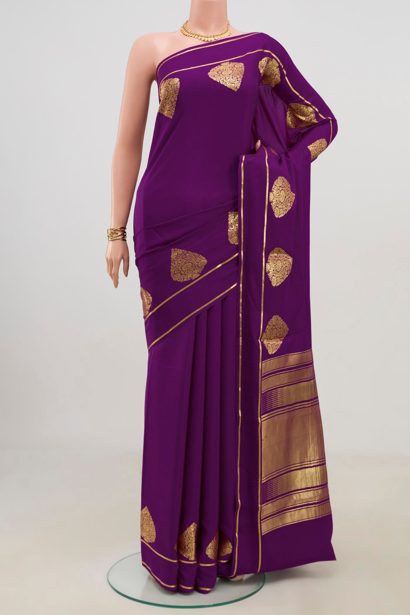 Purple Crepe Saree with Plain Body and Thin Zari Line.  displayed on a mannequin
