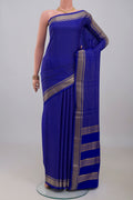 Royal Blue Mysore Crepe Saree with Checked design on the body and Zari Border.  displayed on a mannequin