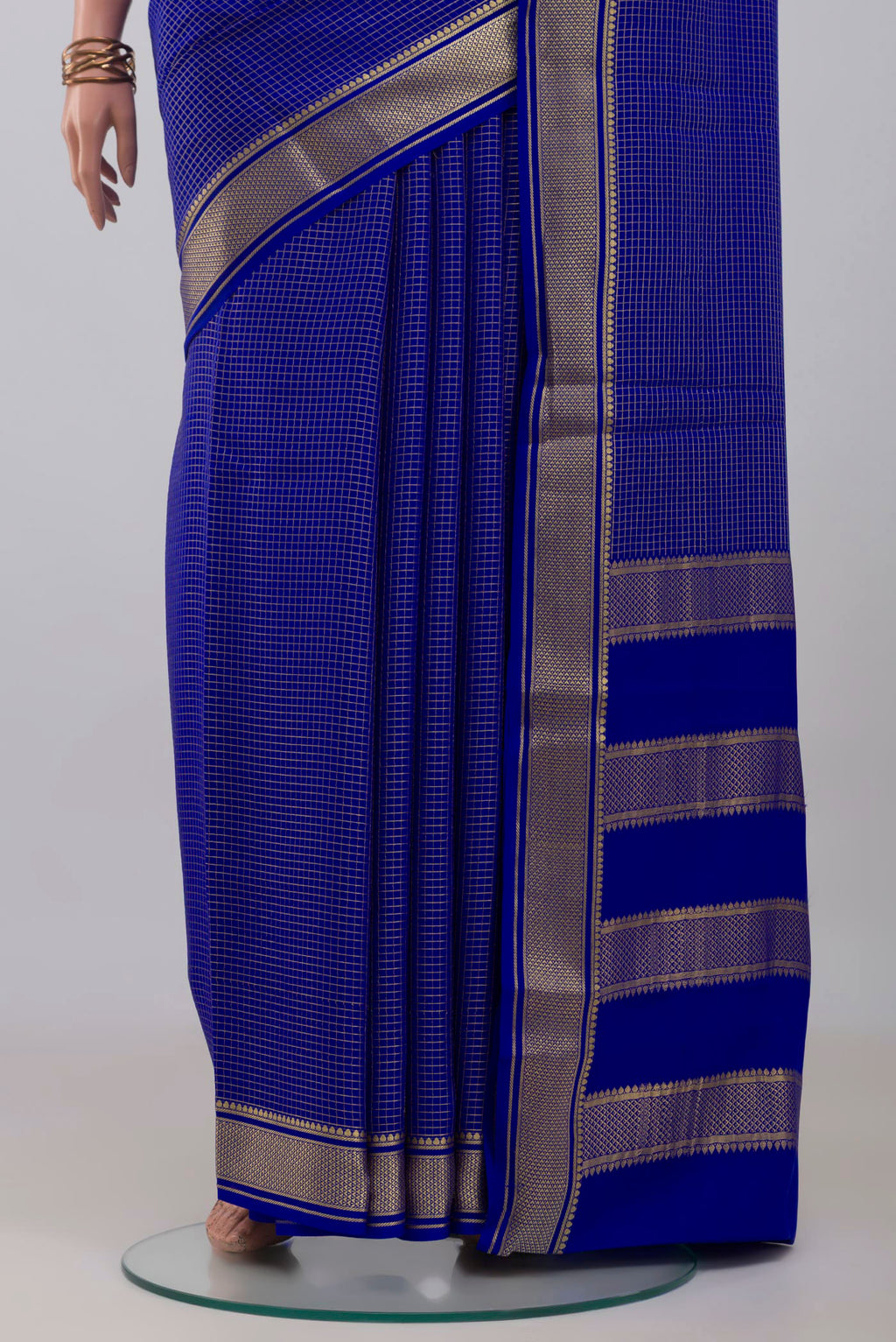Pleats and pallu of Royal Blue Mysore Crepe Saree with Checked design on the body and Zari Border. 