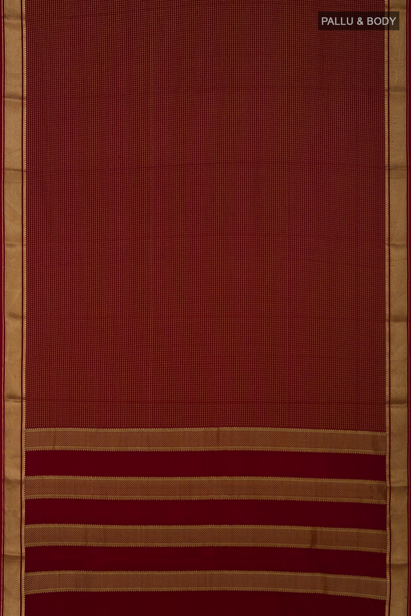 Flat view of Maroon Mysore Crepe Saree with Checked design on the body and Zari Border. 