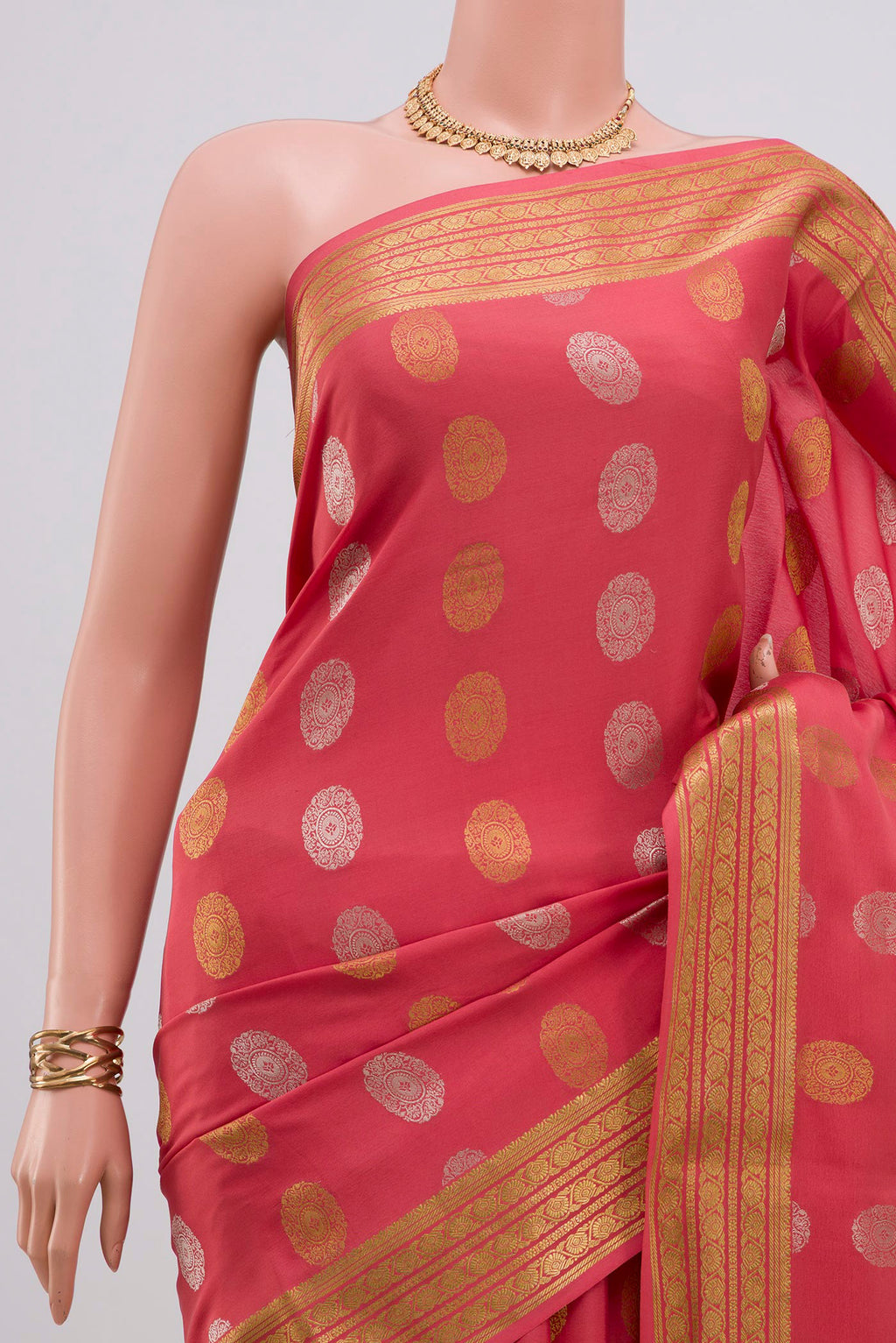 Border image of Peach Crepe Saree with Zari Butta on the body and Zari Border. 