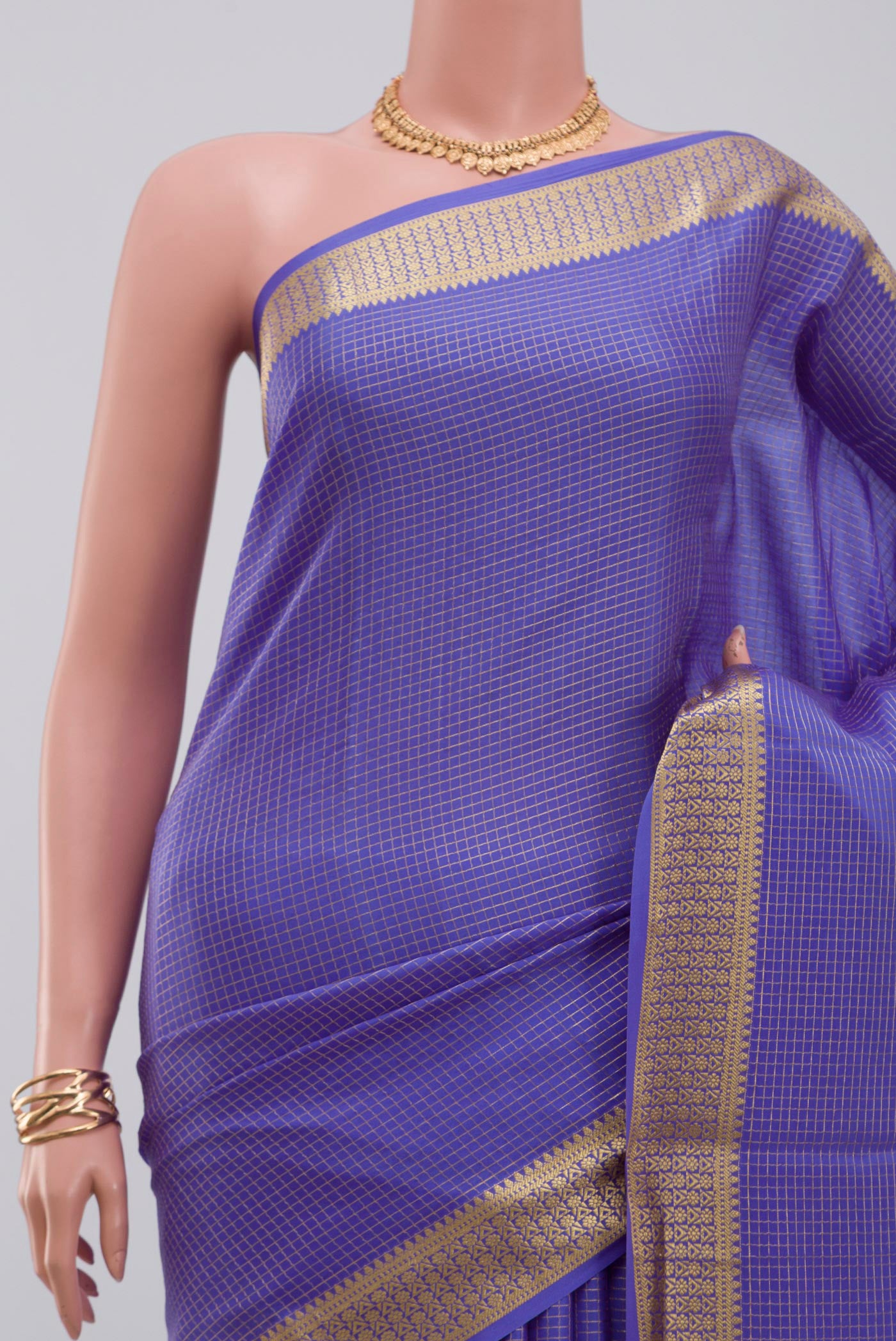 Border image of Blue Crepe Saree with Checked design on the body and Zari Border. 
