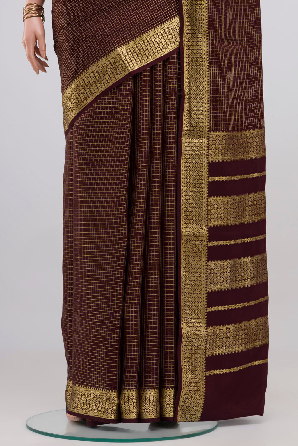 Pleats and pallu of Purple Mysore Crepe Saree with Checked design on the body and Zari Border. 