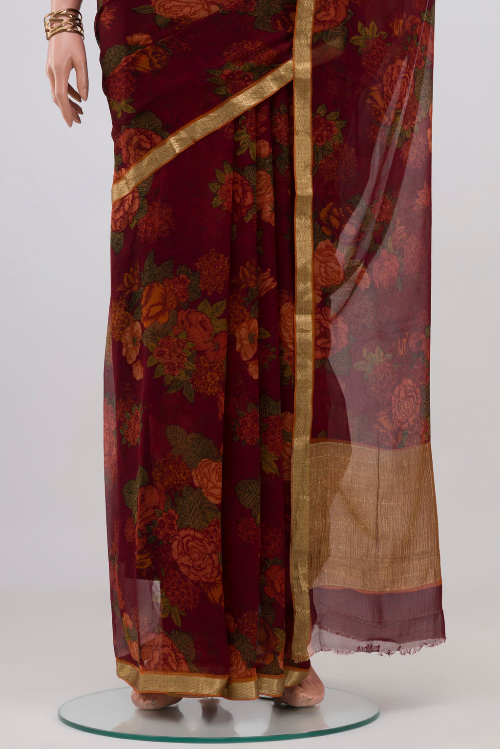 Pleats and pallu of Coffee Brown Mysore Chiffon Saree with Floral Print on the body and Zari Border. 