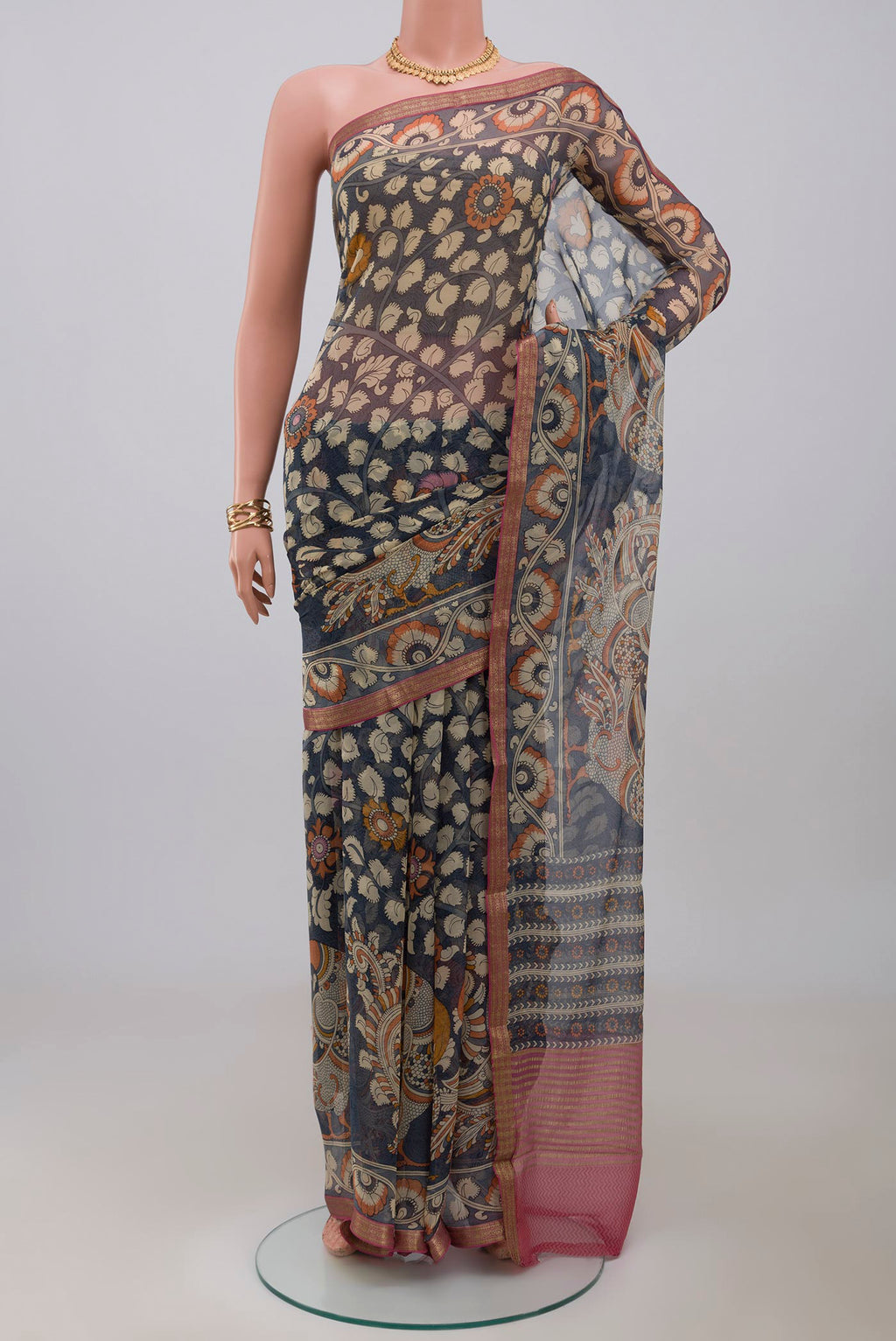 Blue Grey Chiffon Saree with Printed design on the body and Zari Border.  displayed on a mannequin