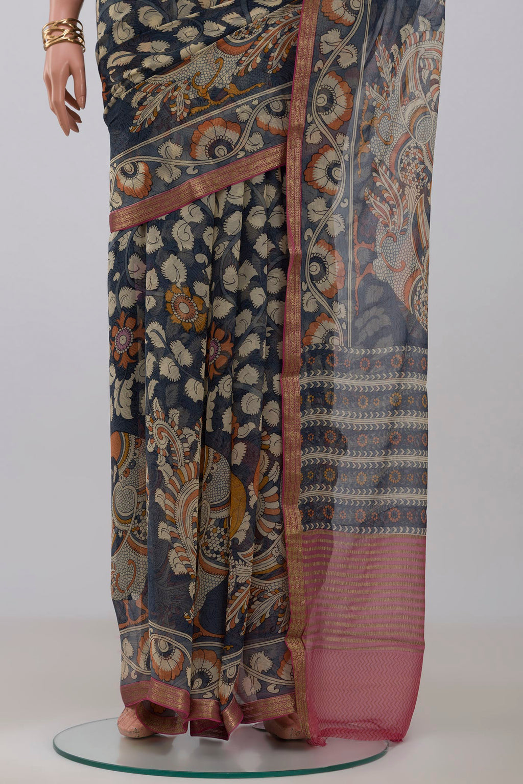 Pleats and pallu of Blue Grey Chiffon Saree with Printed design on the body and Zari Border. 
