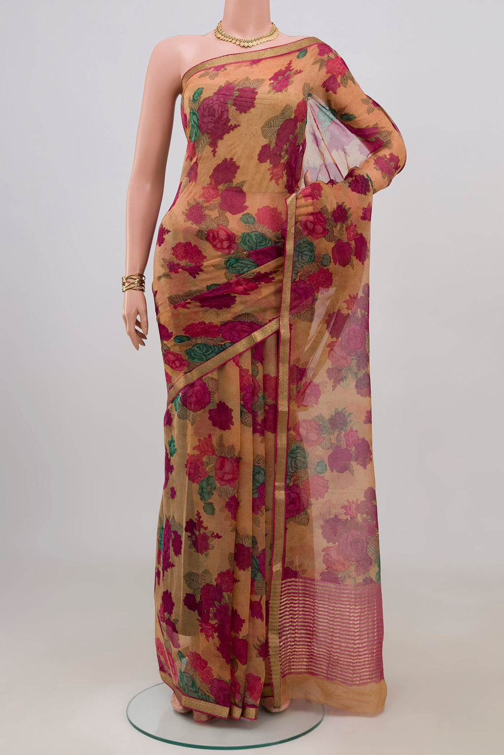 Brown Mysore Chiffon Saree with Floral Print on the body and Zari Border.  displayed on a mannequin