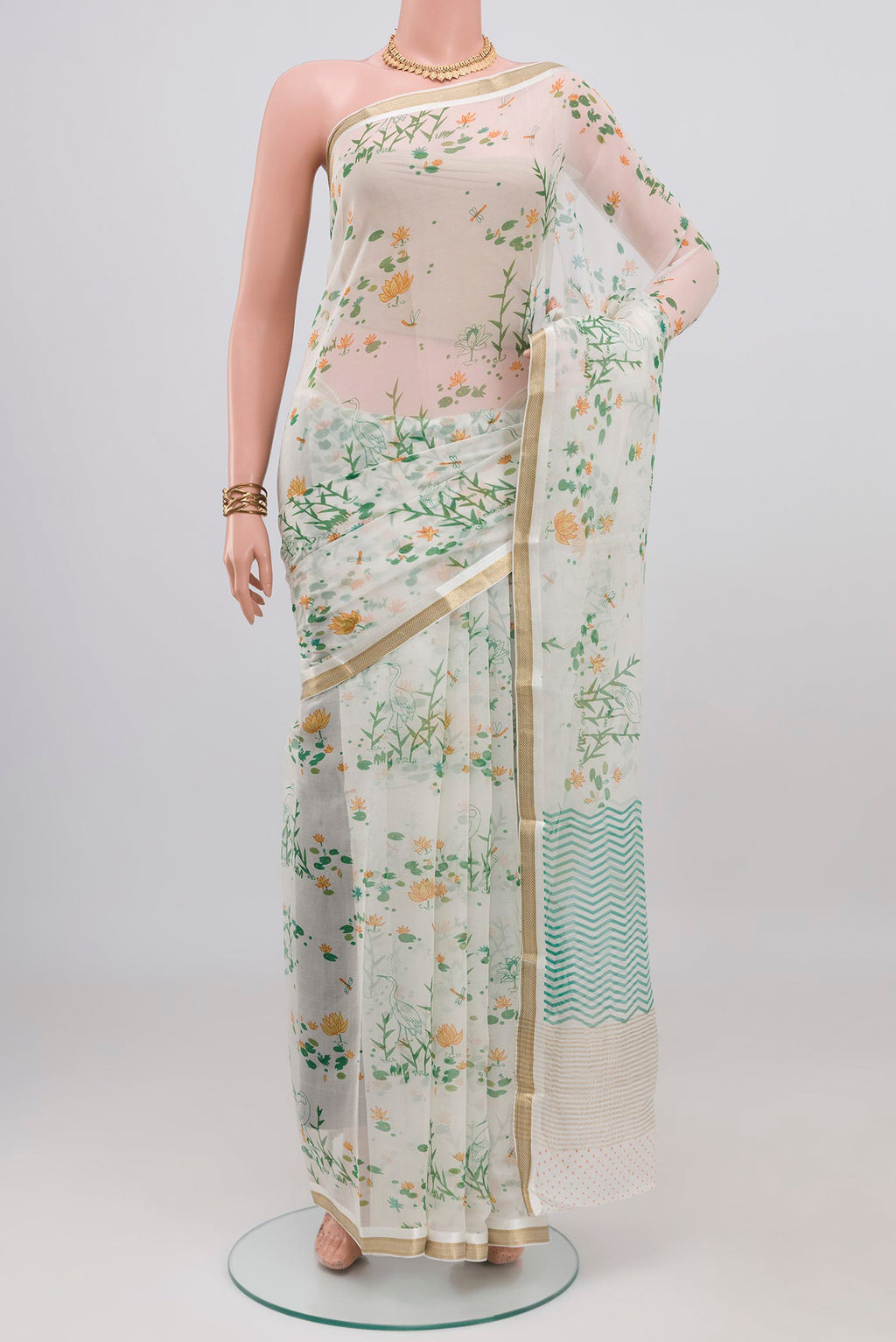 White Mysore Chiffon Saree with Floral Print on the body and Zari Border.  displayed on a mannequin
