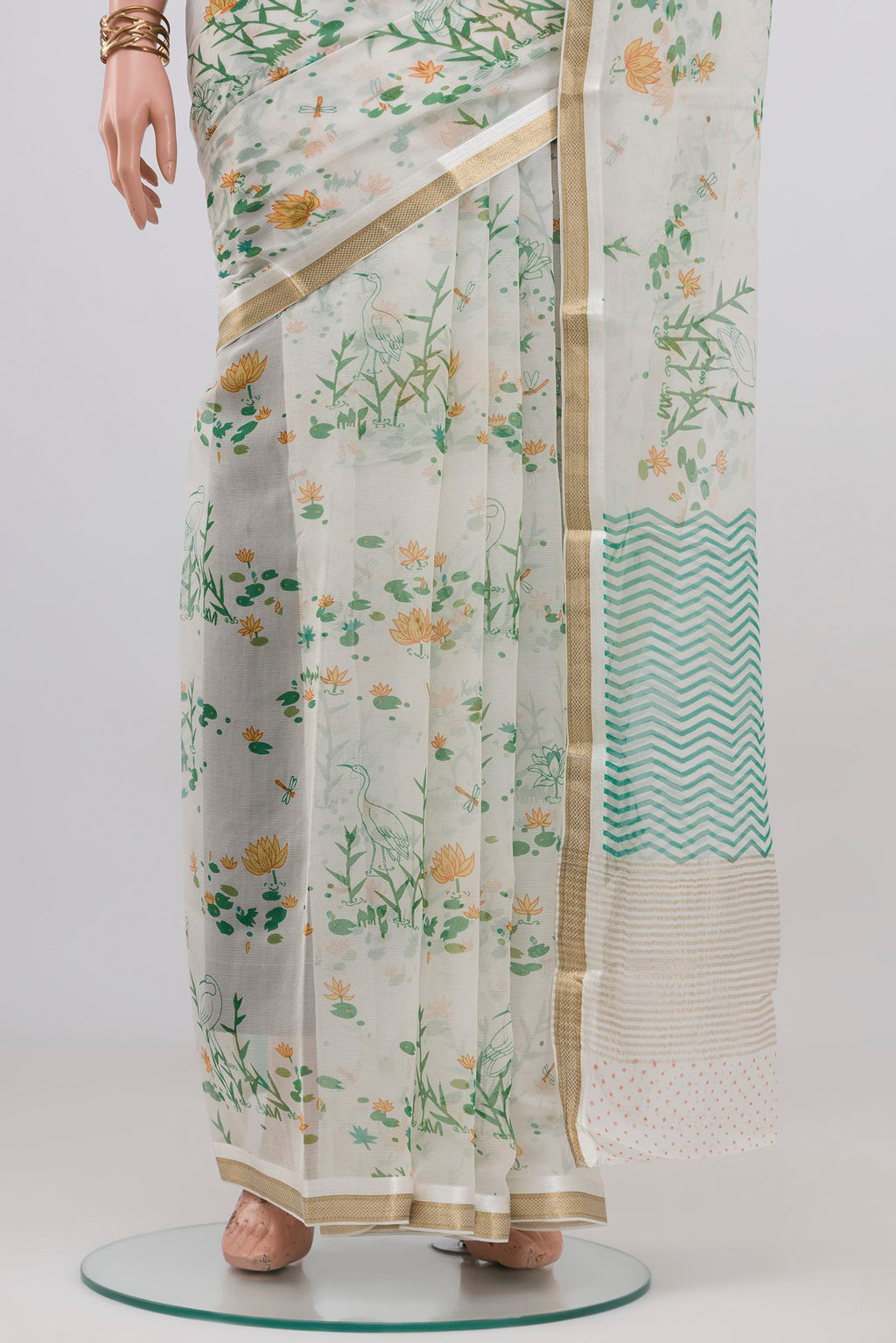 Pleats and pallu of White Mysore Chiffon Saree with Floral Print on the body and Zari Border. 