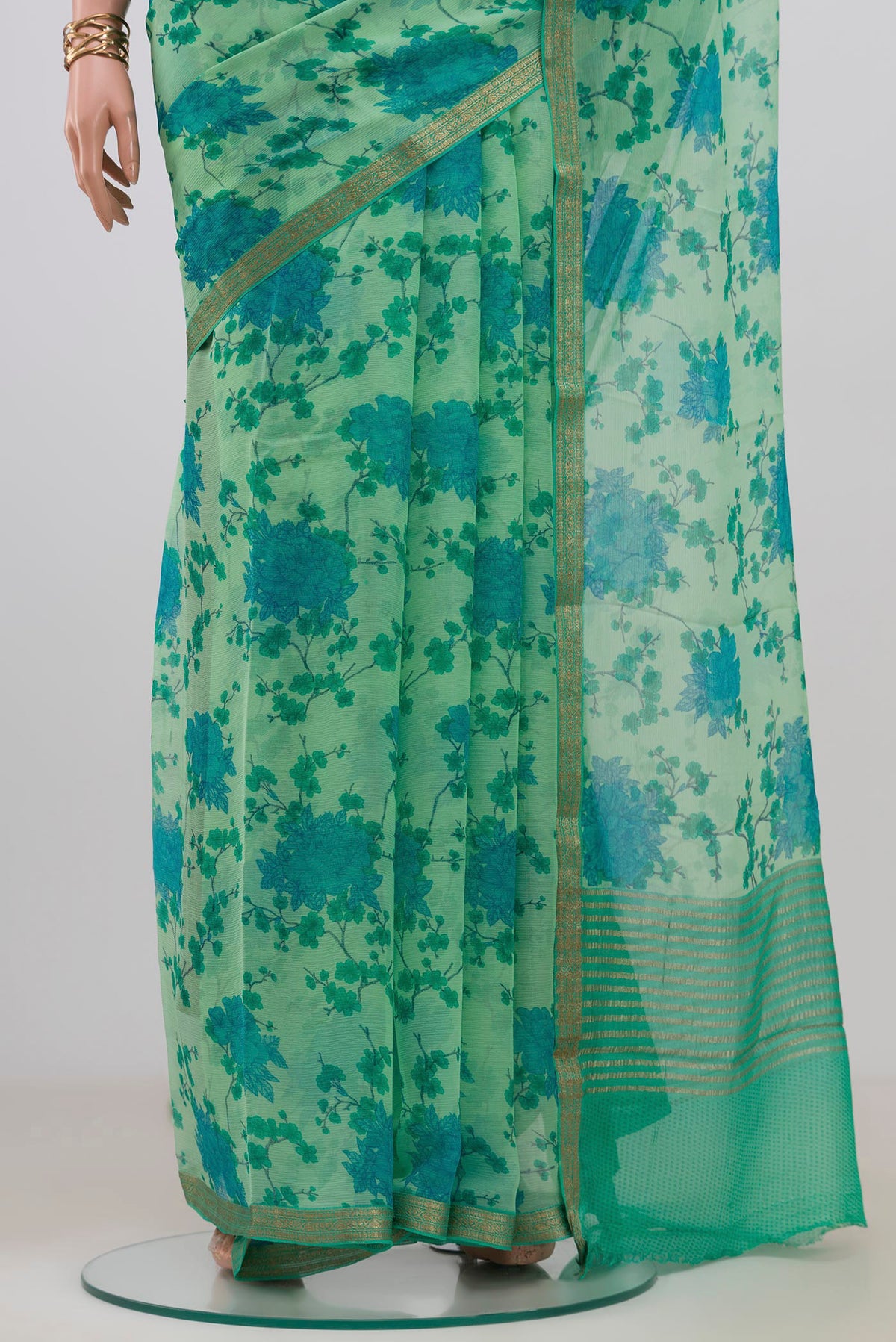Pleats and pallu of Mint Green Mysore Chiffon Saree with Floral Print on the body and Zari Border. 