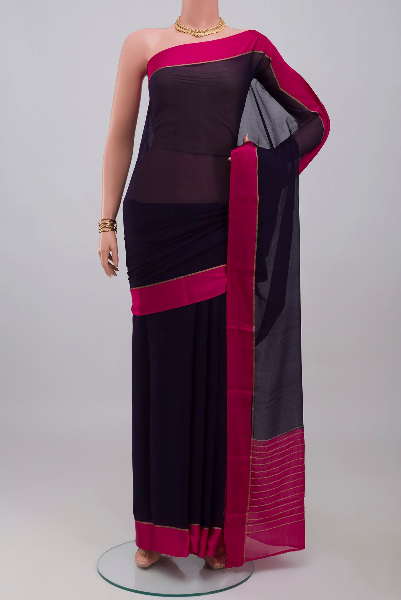 Navy Blue Mysore Chiffon Saree with Plain Body and Plain Border.  displayed on a mannequin