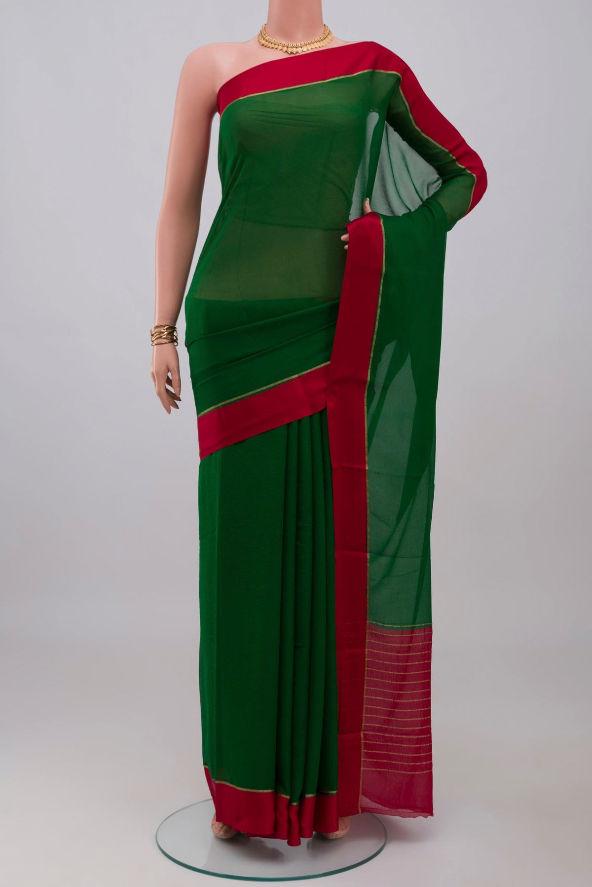 Green Mysore Chiffon Saree with Plain Body and Plain Border.  displayed on a mannequin