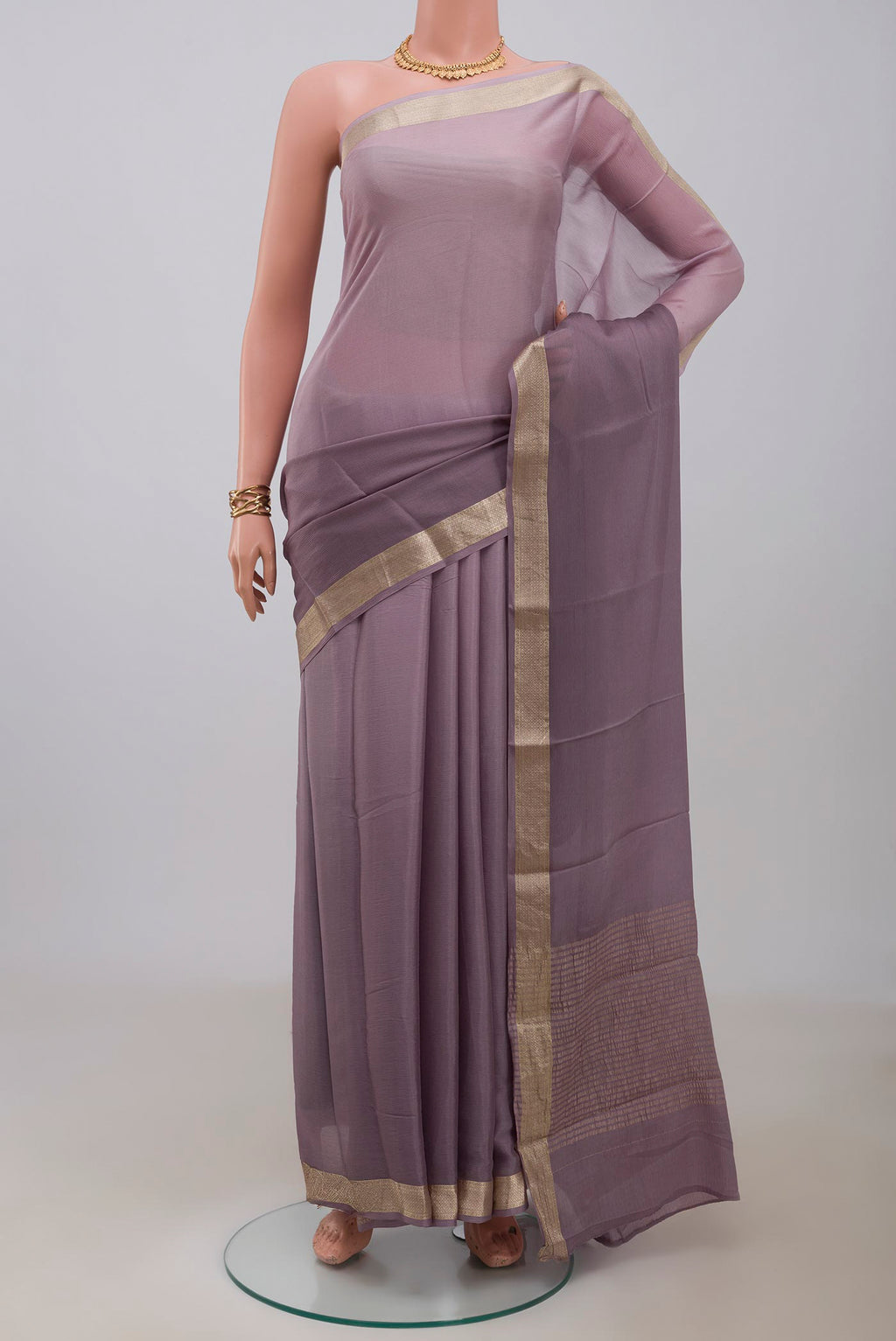 Lavender Mysore Chiffon Saree with Plain Body and Zari Border.  displayed on a mannequin