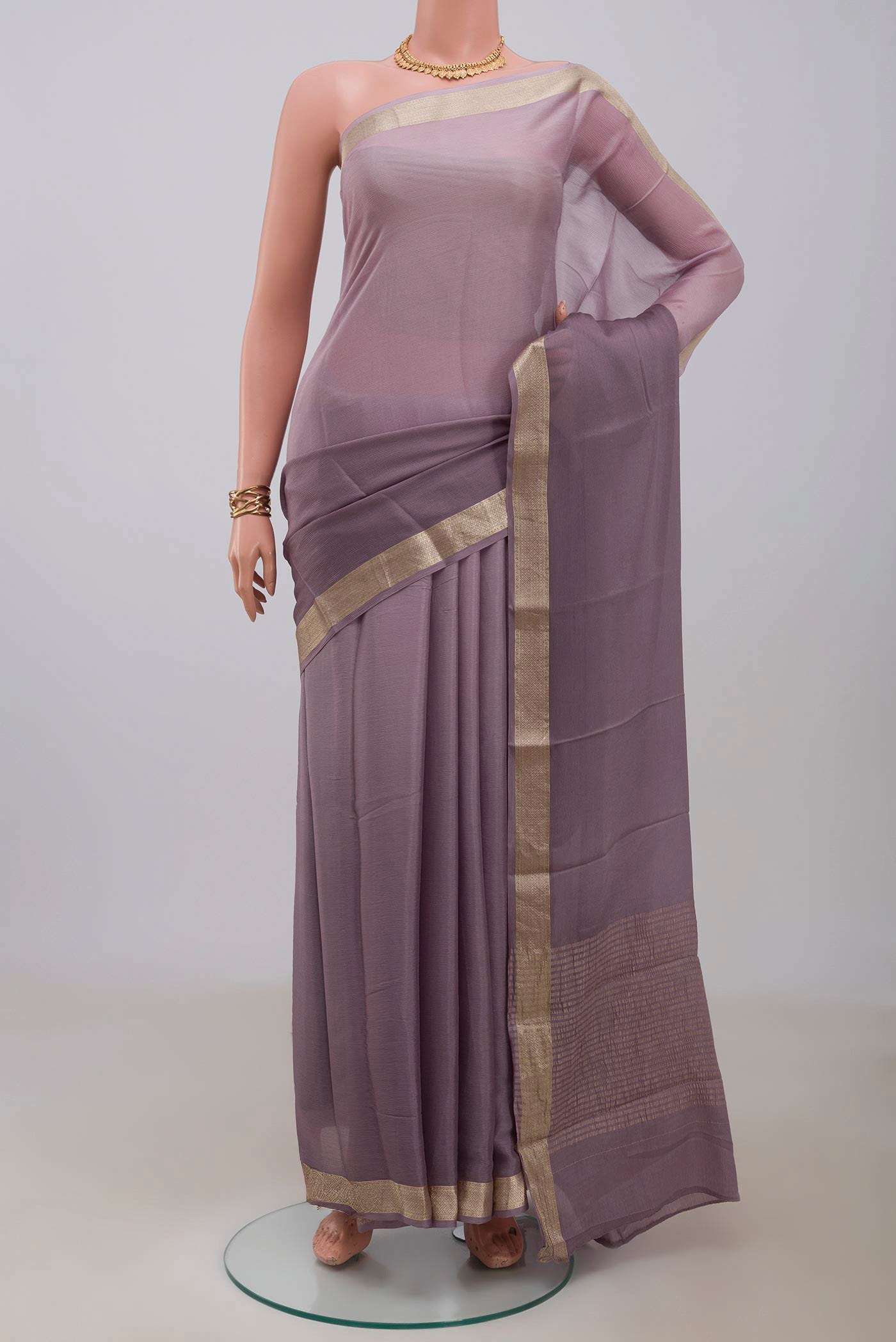 Lavender Mysore Chiffon Saree with Plain Body and Zari Border.  displayed on a mannequin