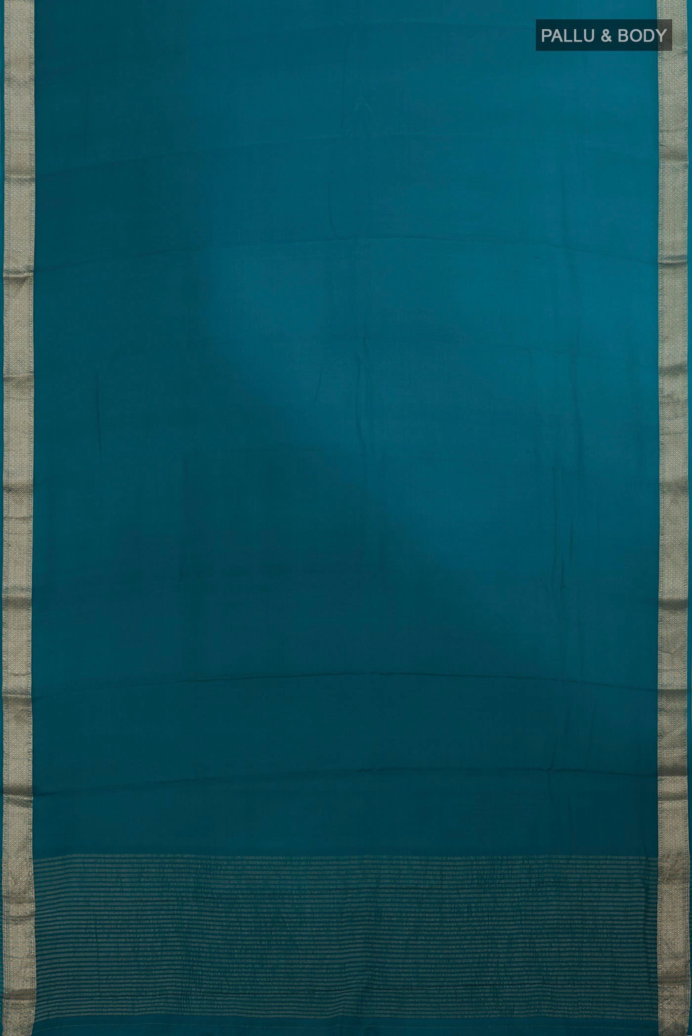 Flat view of Blue Mysore Chiffon Saree with Ombre design on the body and Zari Border. 