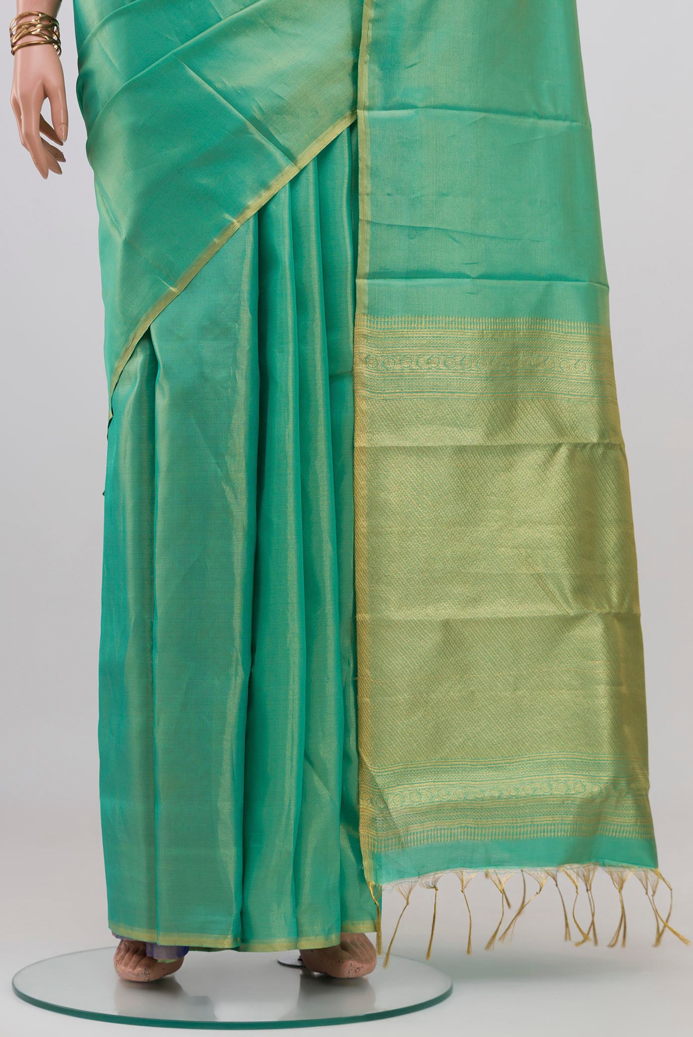 Pleats and pallu of Sea Green Soft Silk Saree with Plain Body and Zari Border. 