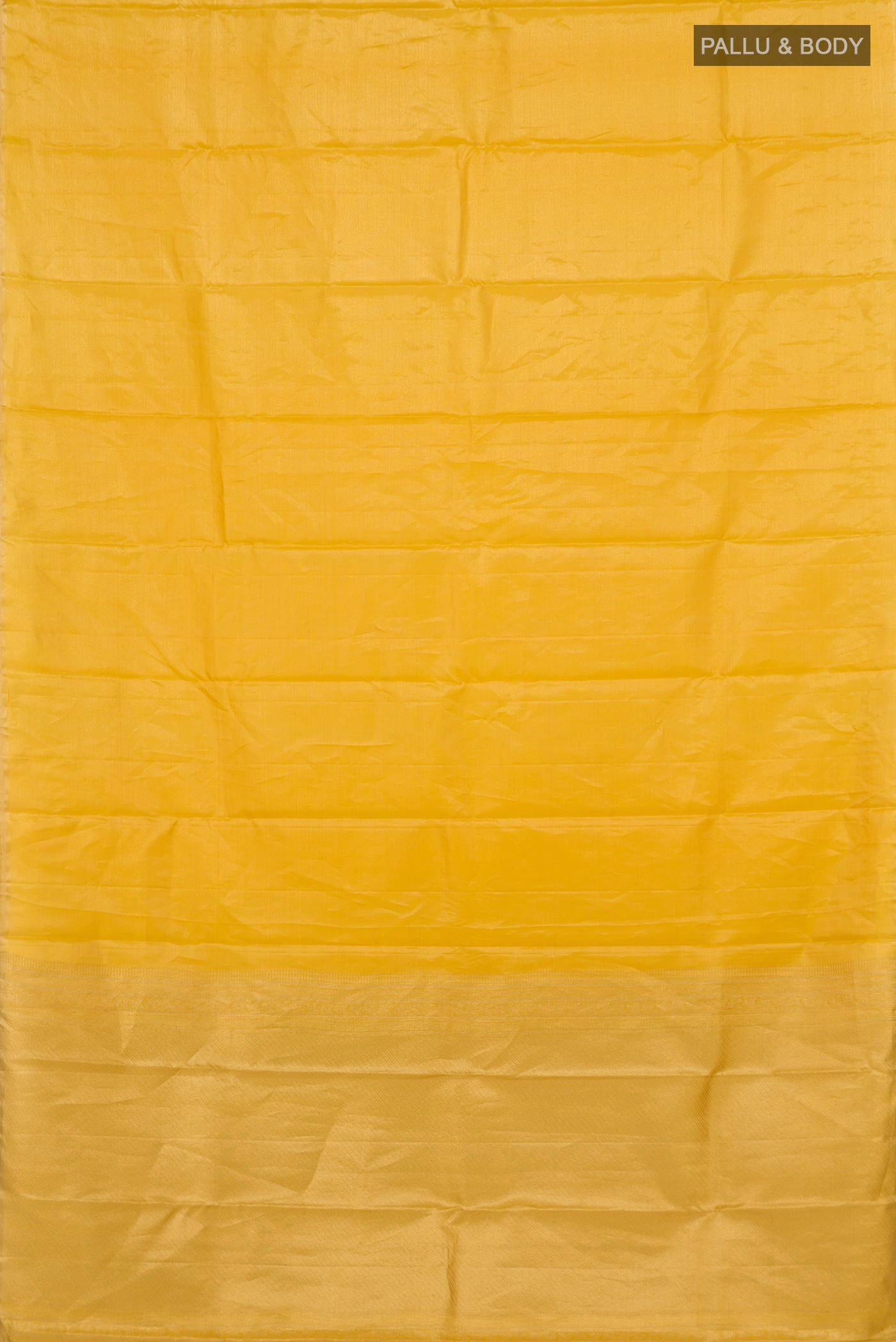 Flat view of Yellow Soft Silk Saree with Plain Body and Zari Border. 