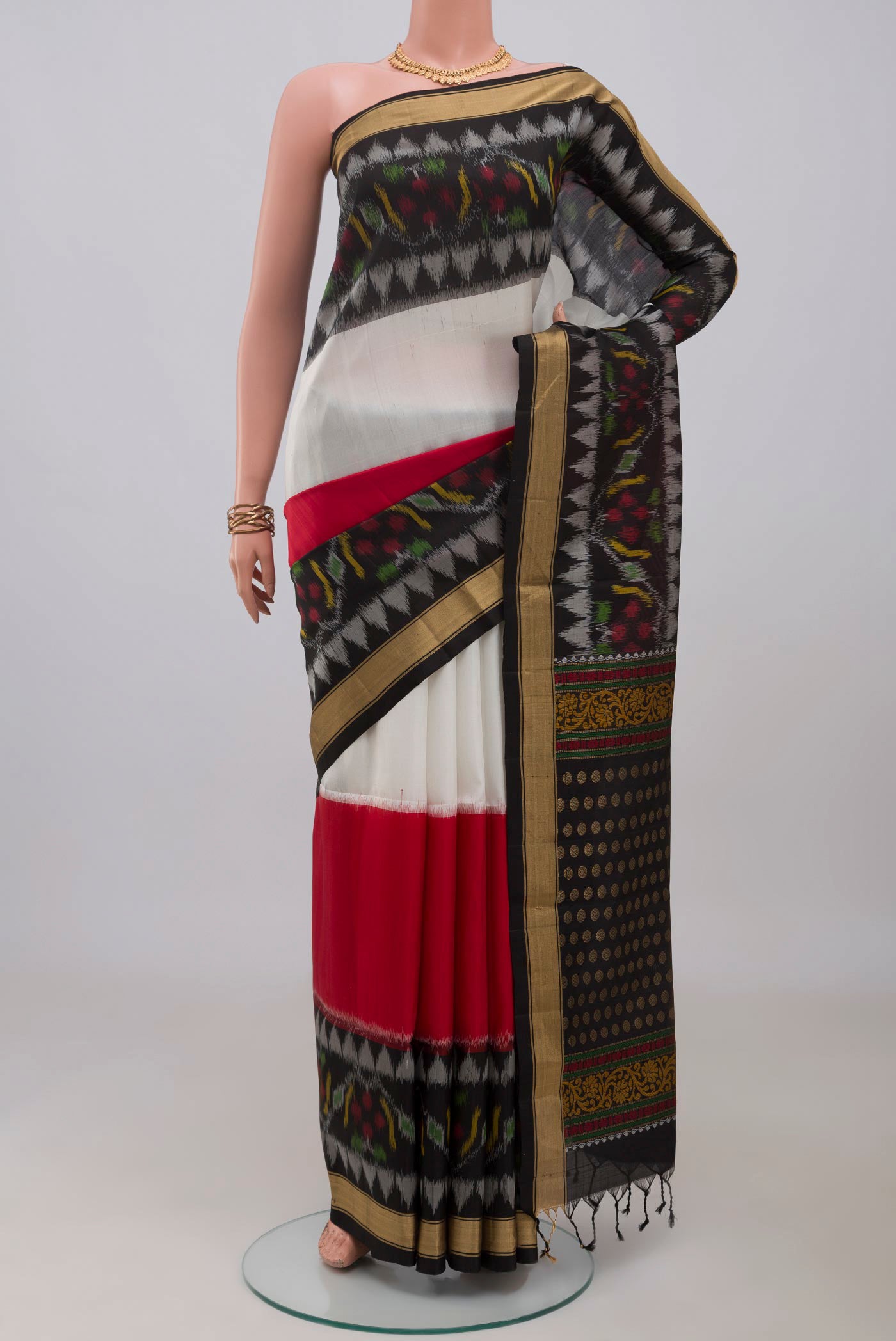 Multi Color Soft Silk Saree with Plain Body and Ikat Border.  displayed on a mannequin
