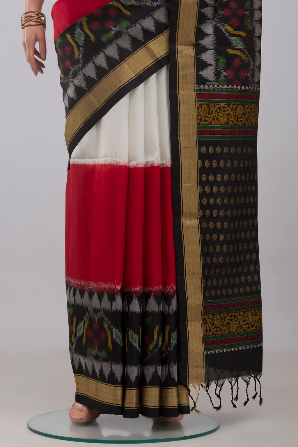 Pleats and pallu of Multi Color Soft Silk Saree with Plain Body and Ikat Border. 