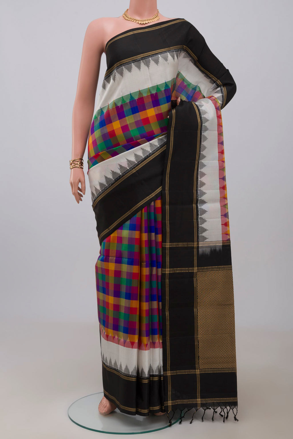 Multi Color Soft Silk Saree with Checked design on the body and Plain Border.  displayed on a mannequin