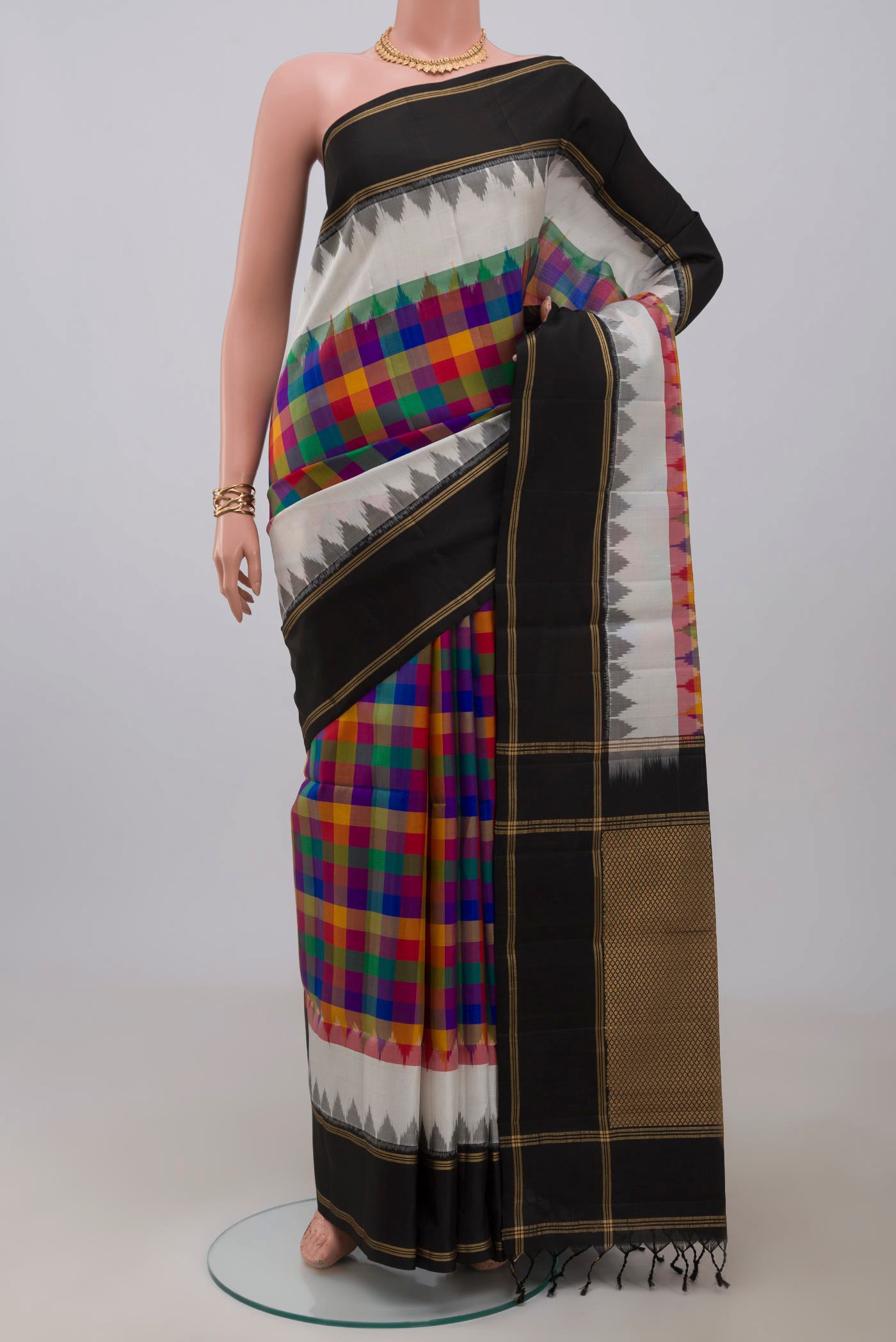 Multi Color Soft Silk Saree with Checked design on the body and Plain Border.  displayed on a mannequin