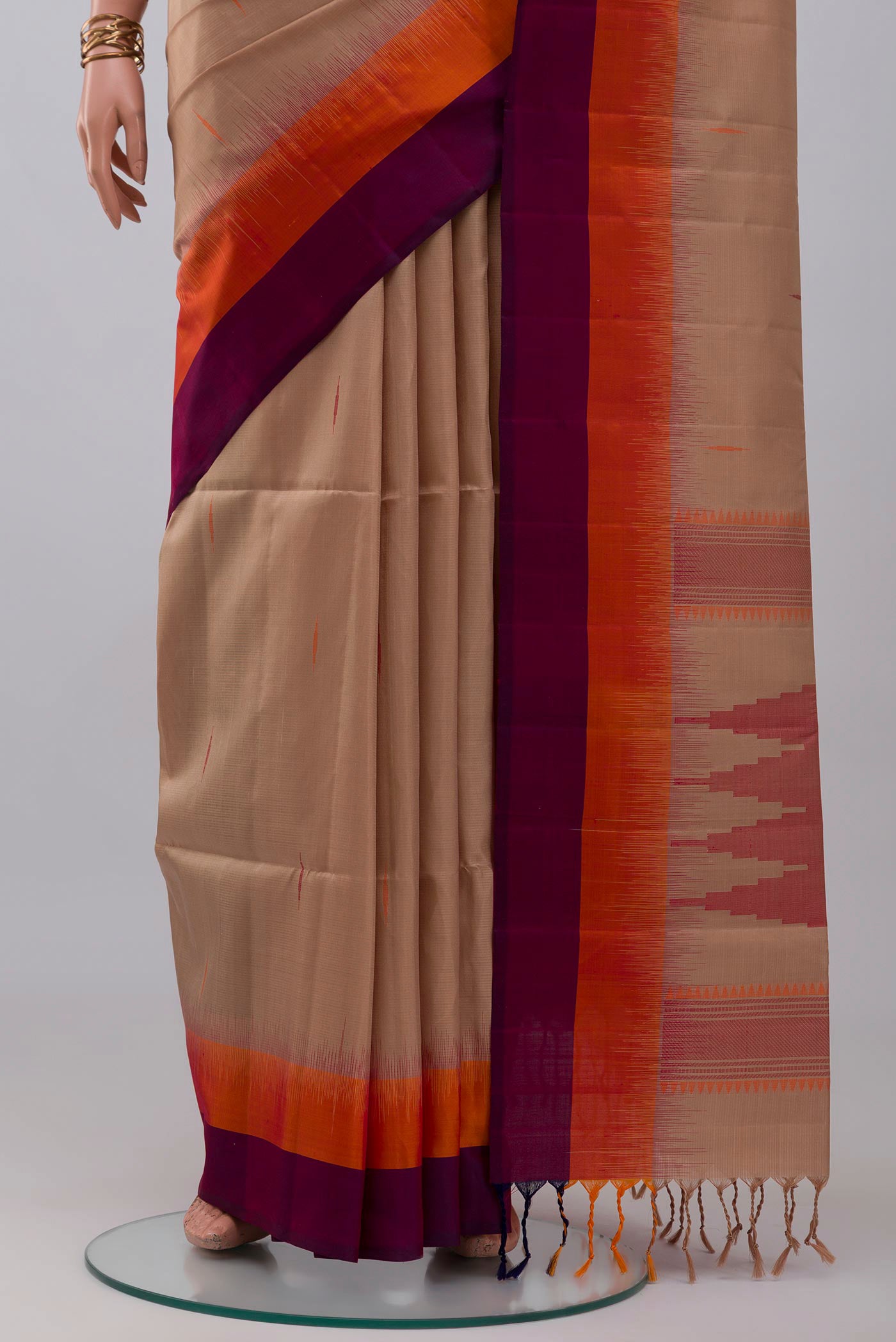 Pleats and pallu of Brown Soft Silk Saree with Thread Butta on the body and Plain Border. 