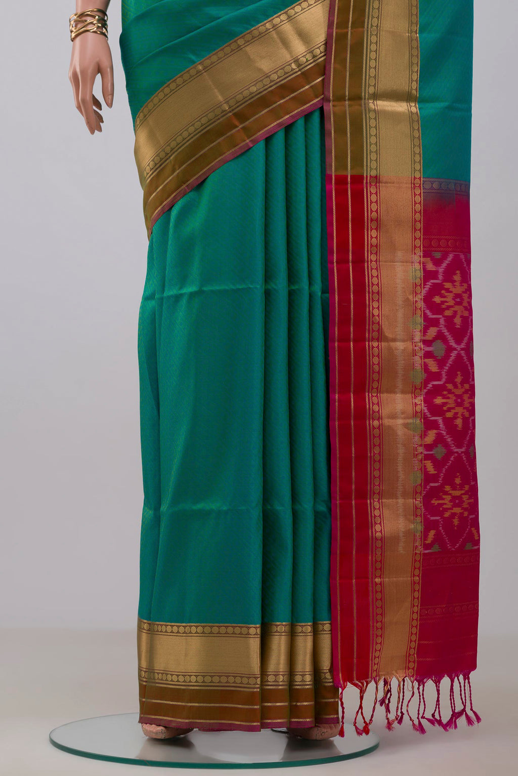 Pleats and pallu of Green Soft Silk Saree with Jacquard design on the body and Zari Border. 