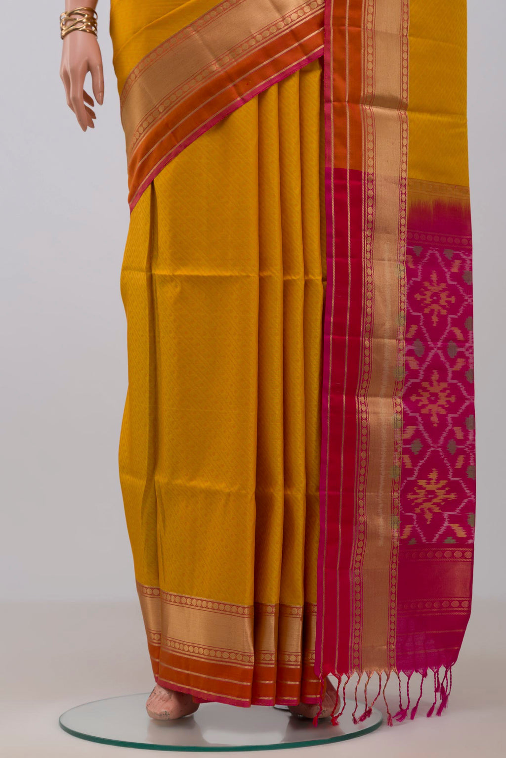 Pleats and pallu of Mustard Soft Silk Saree with Jacquard design on the body and Zari Border. 