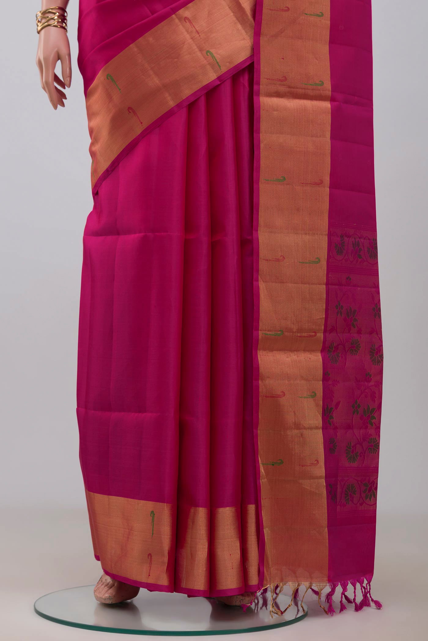 Pleats and pallu of Pink Soft Silk Saree with Zari Butta on the body and Zari Border. 
