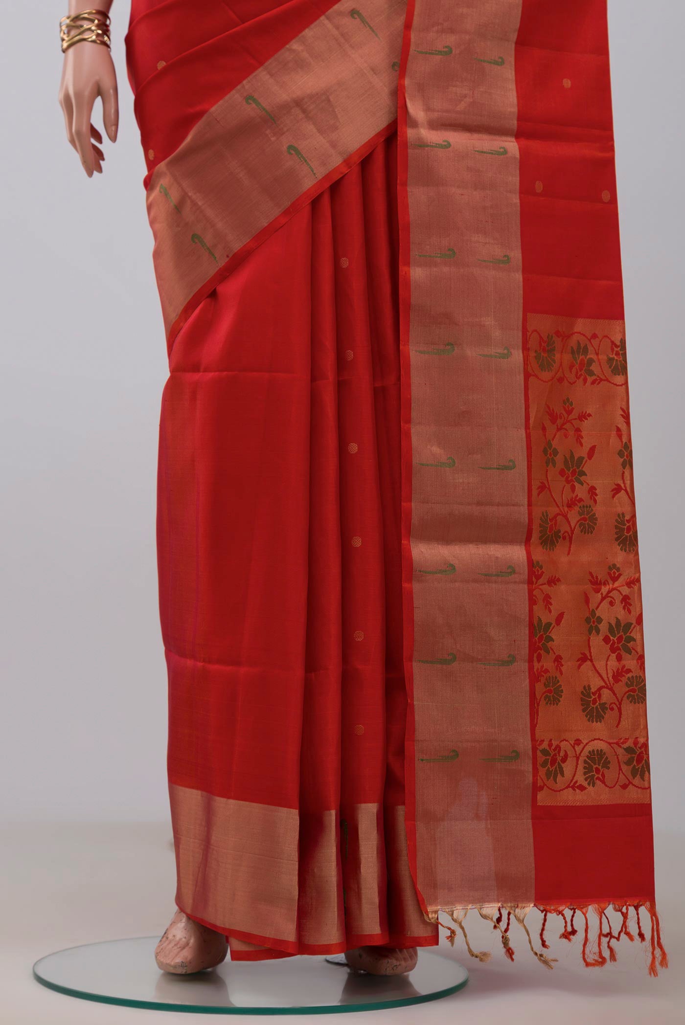 Pleats and pallu of Orange Soft Silk Saree with Fancy on the body and Fancy Border. 