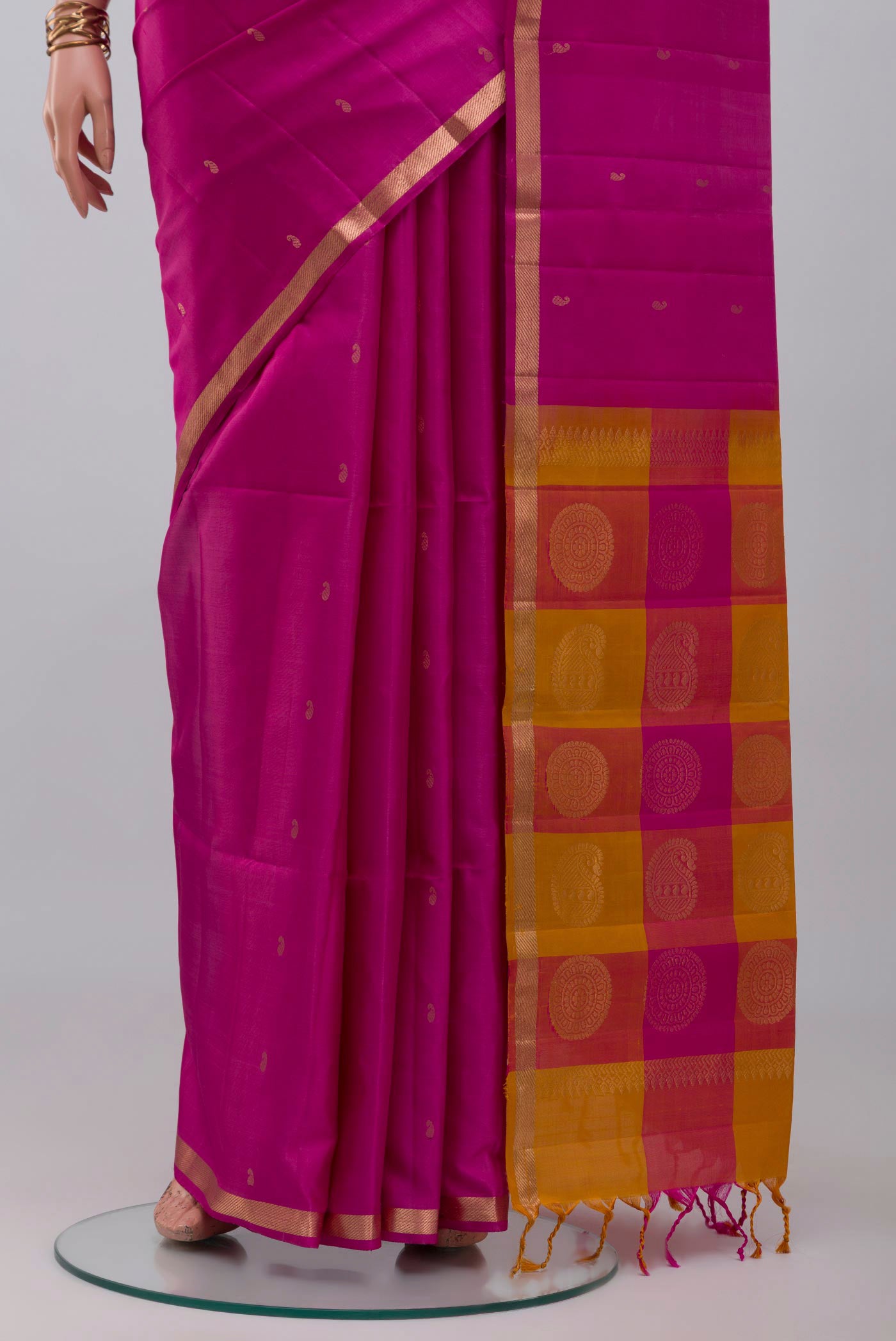 Pleats and pallu of Pink Soft Silk Saree with Zari Butta on the body and Thin Zari Line. 