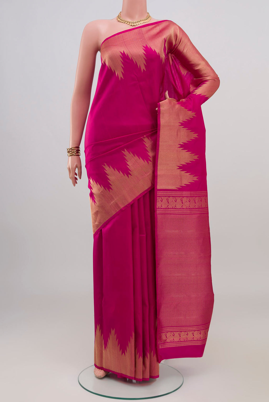 Pink Kanchipuram Silk Saree with Plain Body and Temple Border.  displayed on a mannequin