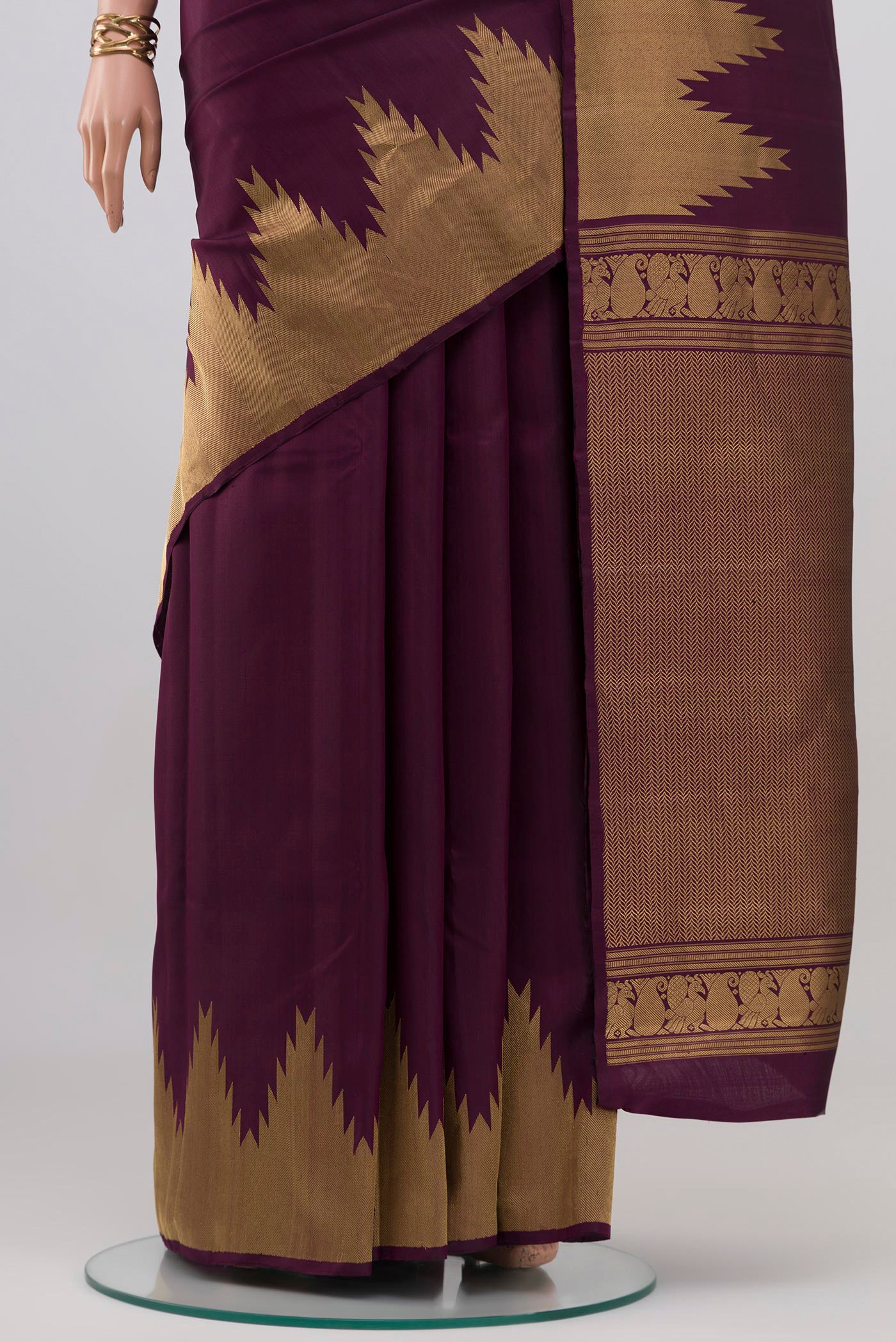 Pleats and pallu of Purple Kanchipuram Silk Saree with Plain Body and Temple Border. 