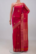 Pink Soft Silk Saree with Zari Butta on the body and Zari Border.  displayed on a mannequin