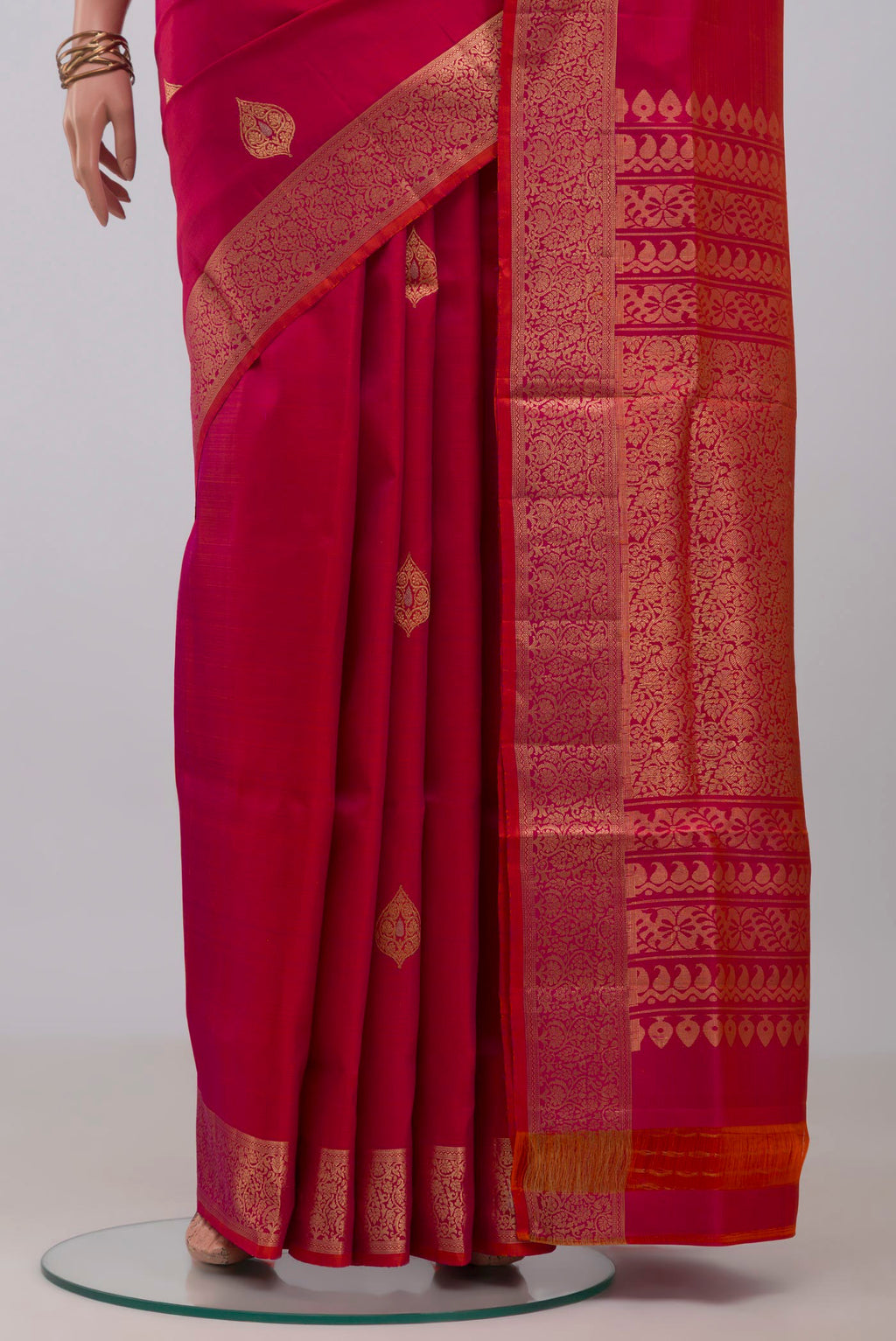 Pleats and pallu of Pink Soft Silk Saree with Zari Butta on the body and Zari Border. 