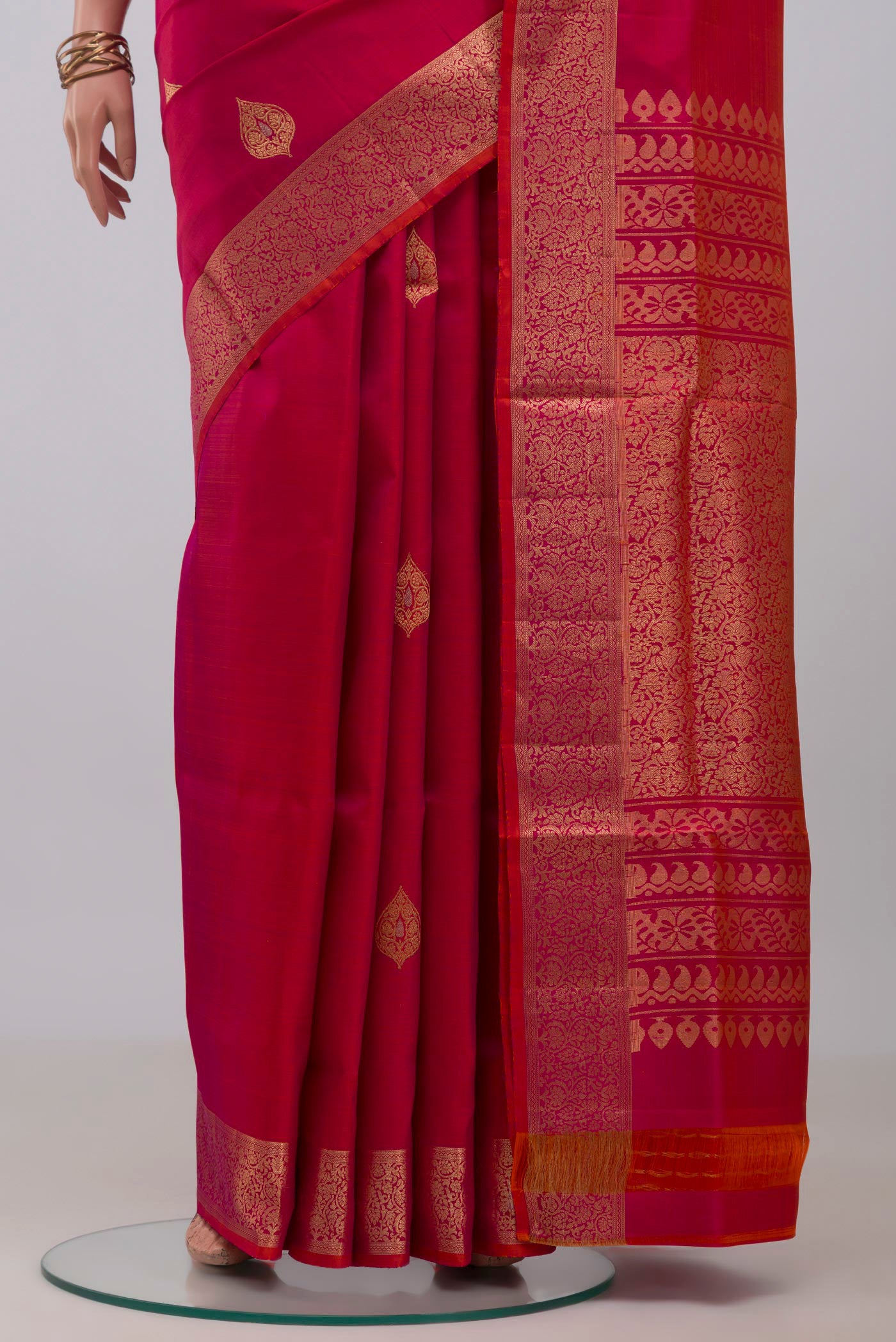Pleats and pallu of Pink Soft Silk Saree with Zari Butta on the body and Zari Border. 