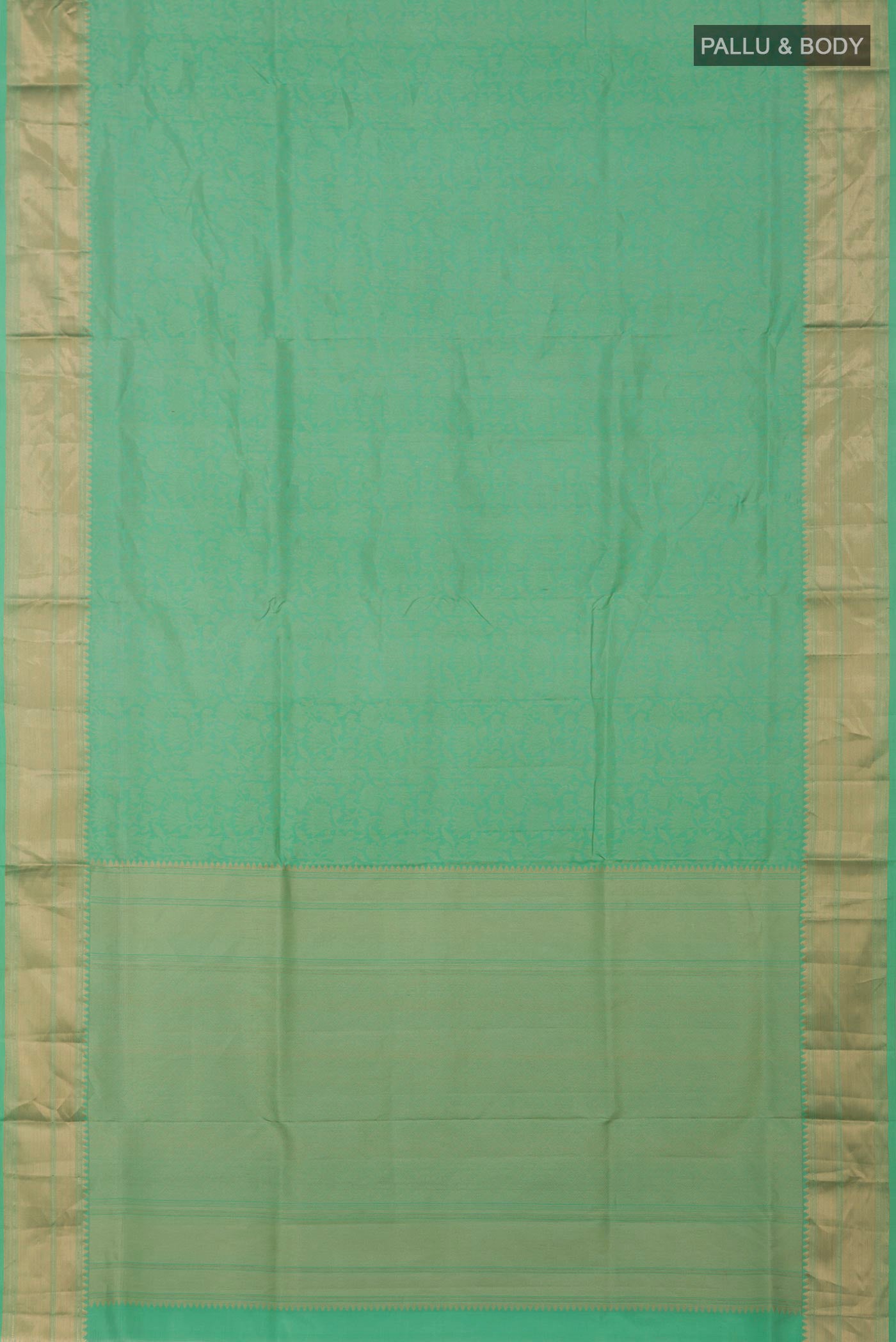 Flat view of Green Soft Silk Saree with Zari Brocade on the body and Zari Border. 